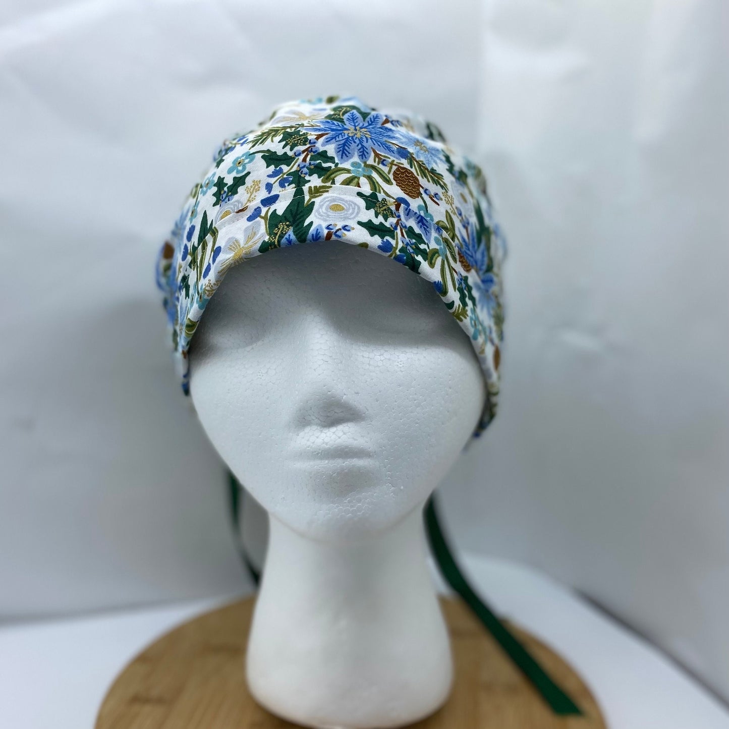 Rifle Paper Co fabric blue and white poinsettias scrub cap, winter floral women’s scrub hat