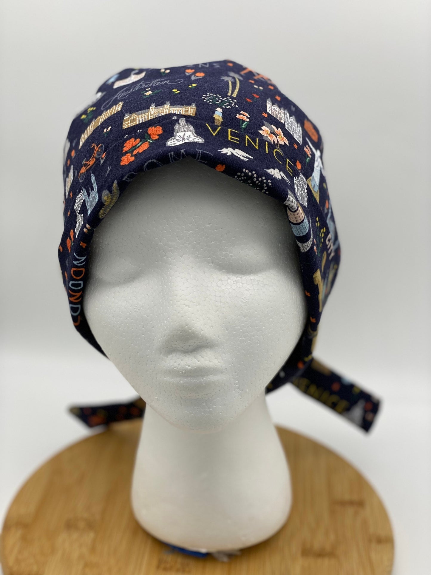 World traveler tie back scrub cap, Bon Voyage navy scrub cap, Bonnet Head Designs