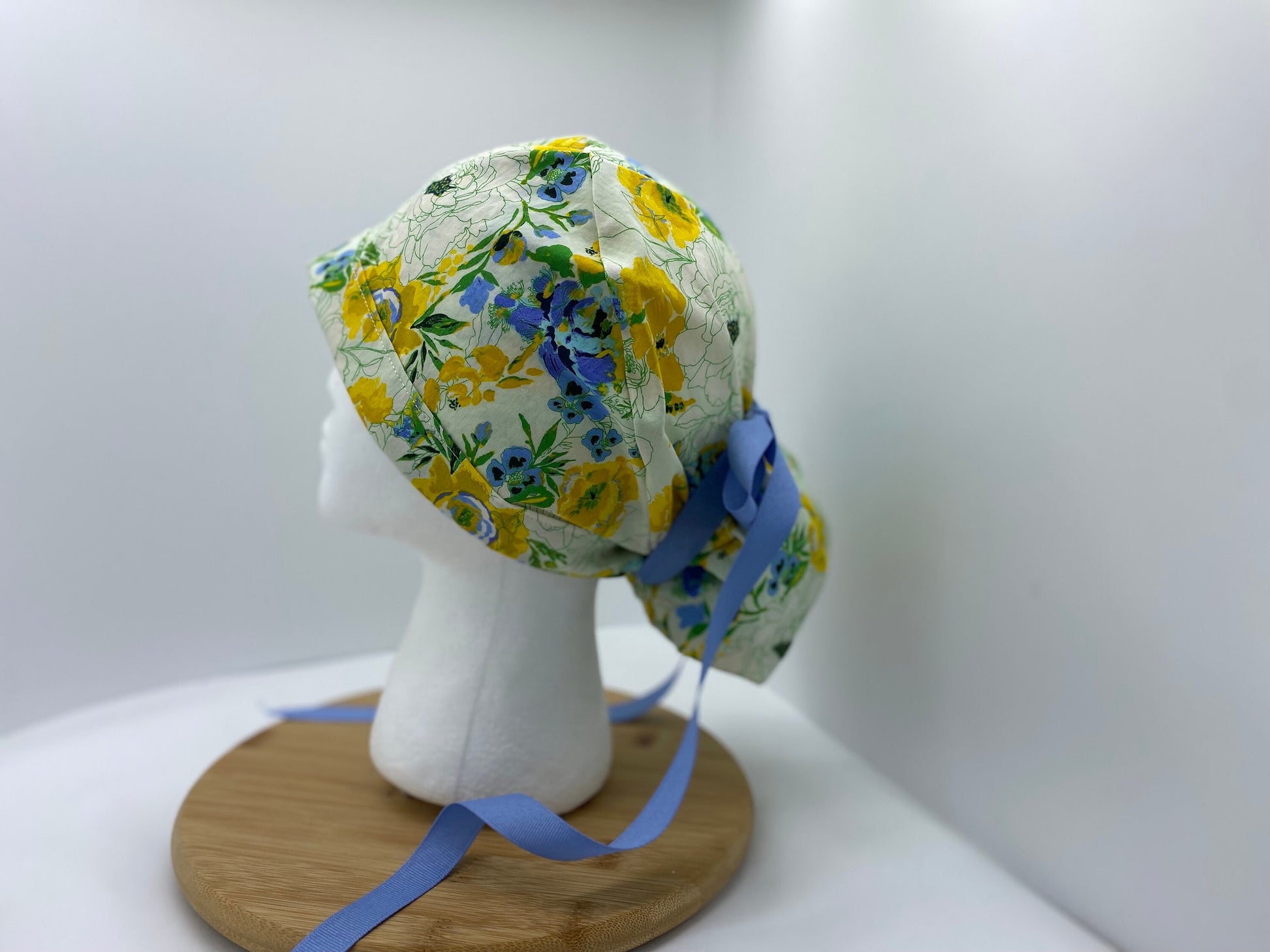 Blue, yellow, and green women’s floral scrub cap, adjustable pouch women’s scrub hat, Bonnet Head Designs