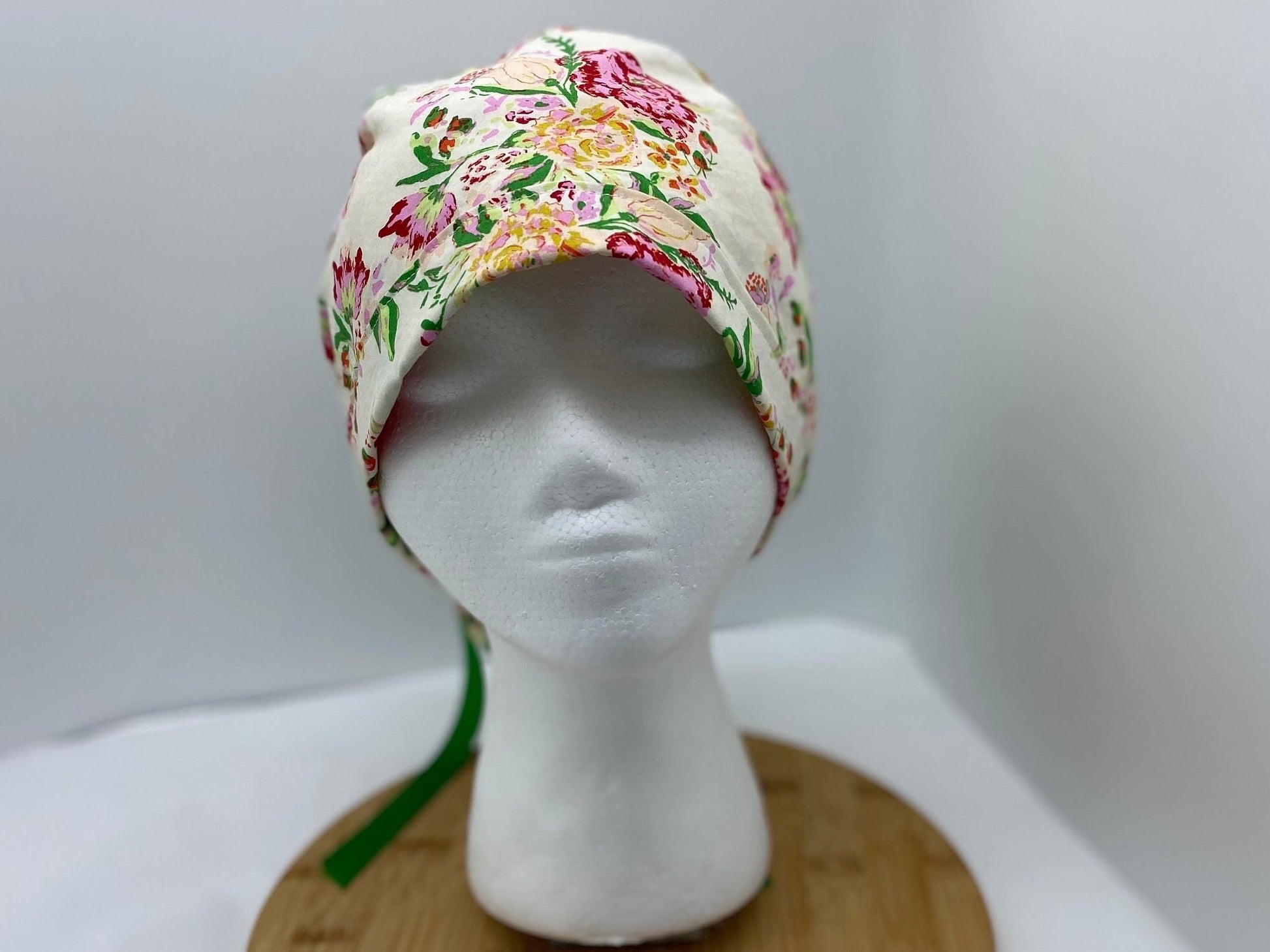 Kelly green floral women’s hat with satin lining option, adjustable pouch scrub cap