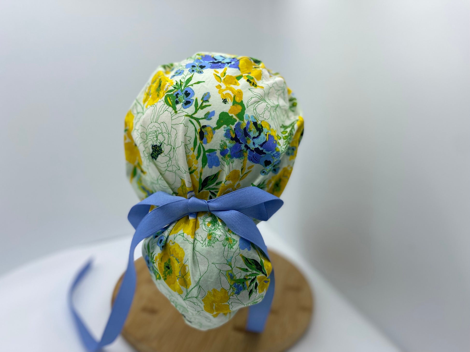 Blue, yellow, and green women’s floral scrub cap, adjustable pouch women’s scrub hat, Bonnet Head Designs