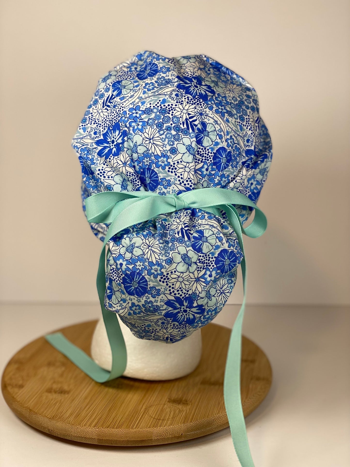 Shades of blue women’s floral scrub cap, blue floral ponytail scrub hat