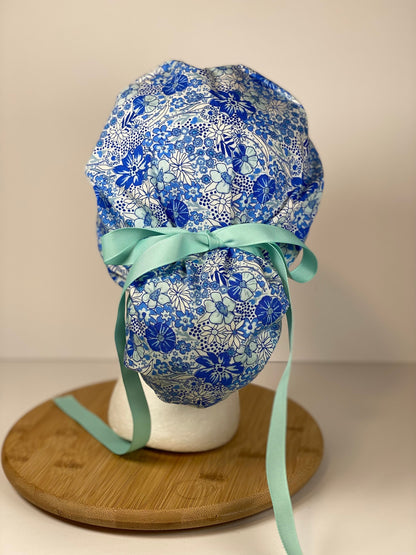 Shades of blue women’s floral scrub cap, blue floral ponytail scrub hat