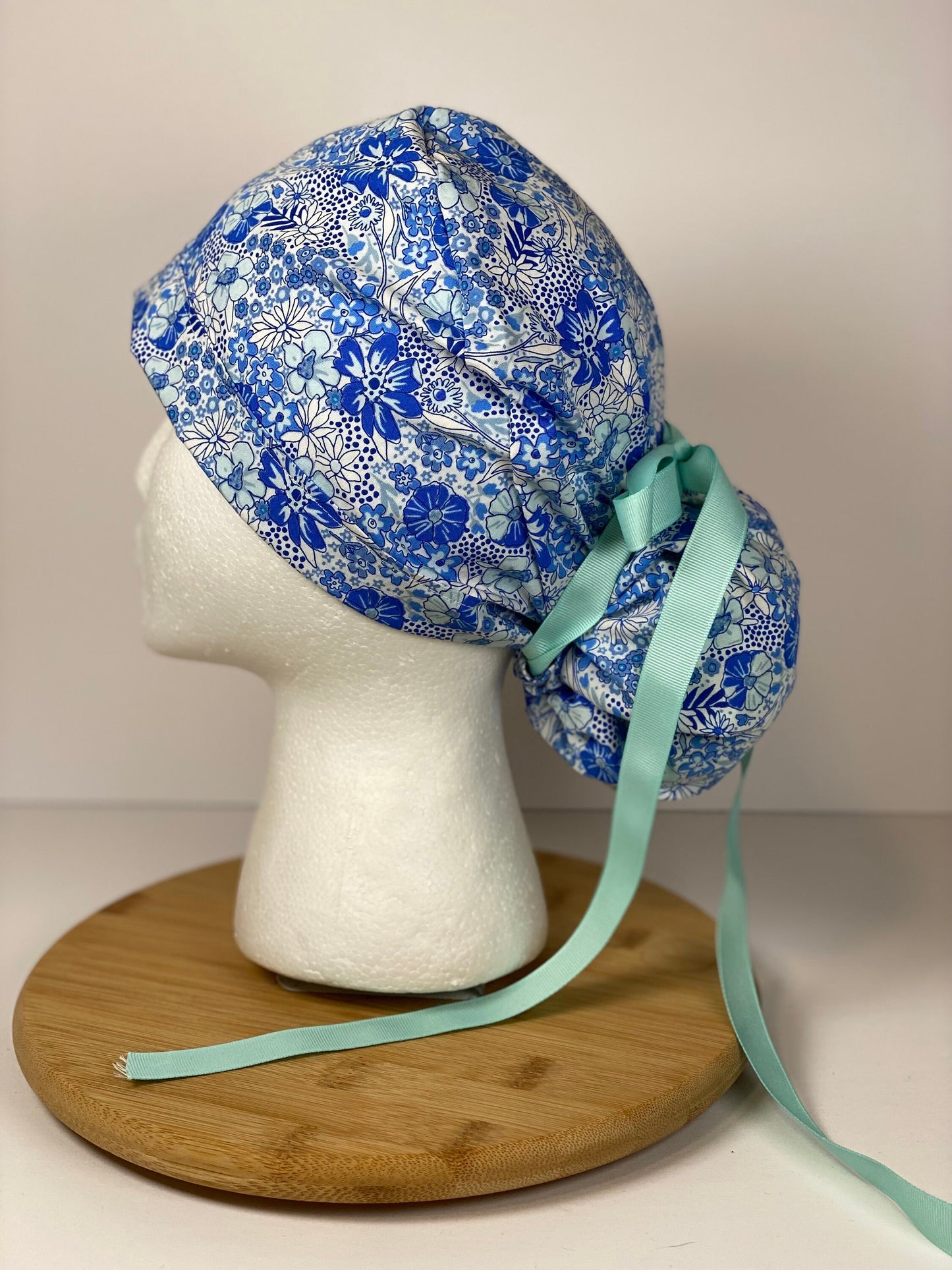 Shades of blue women’s floral scrub cap, blue floral ponytail scrub hat