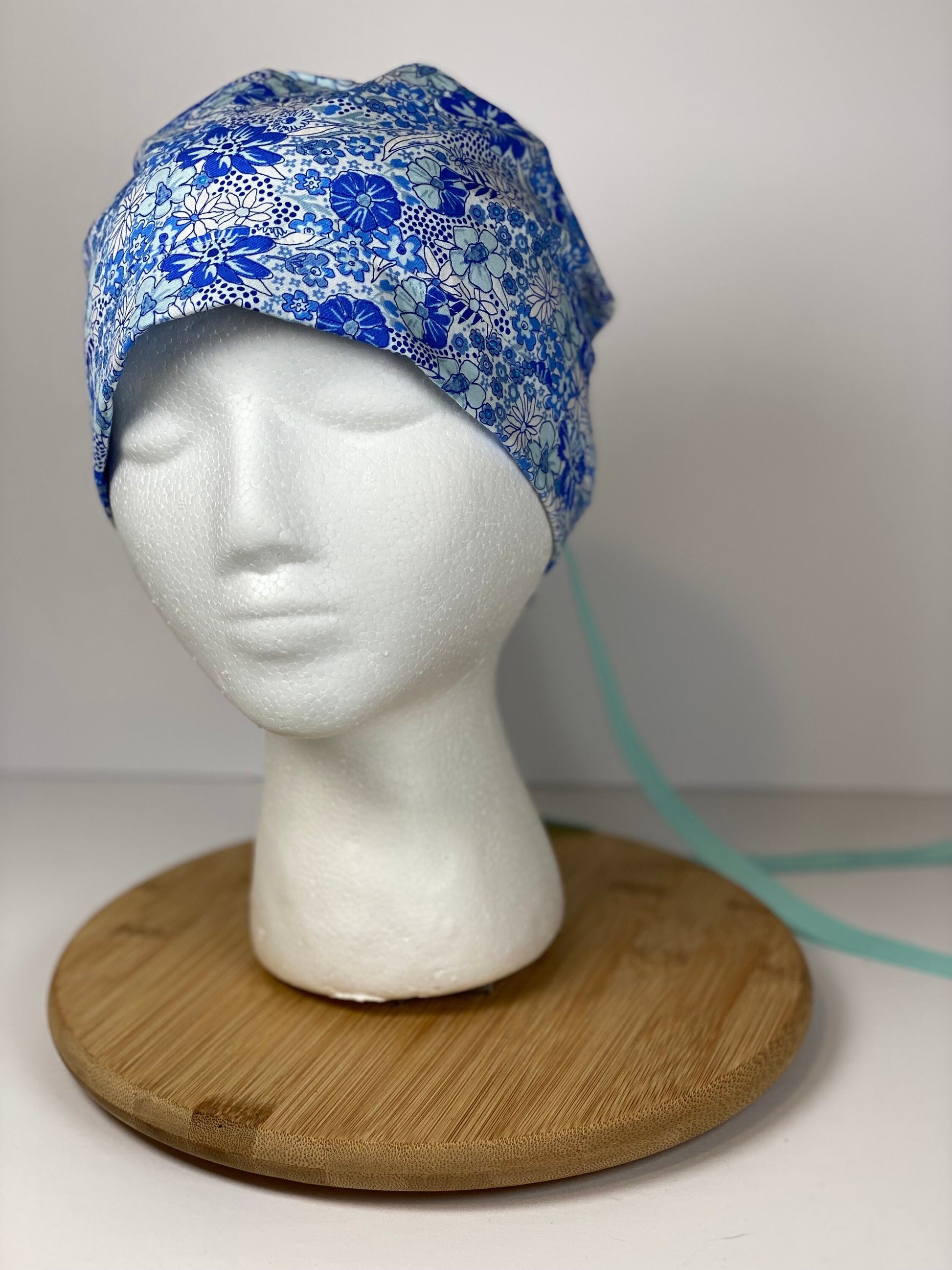 Shades of blue women’s floral scrub cap, blue floral ponytail scrub hat