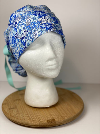 Shades of blue women’s floral scrub cap, blue floral ponytail scrub hat