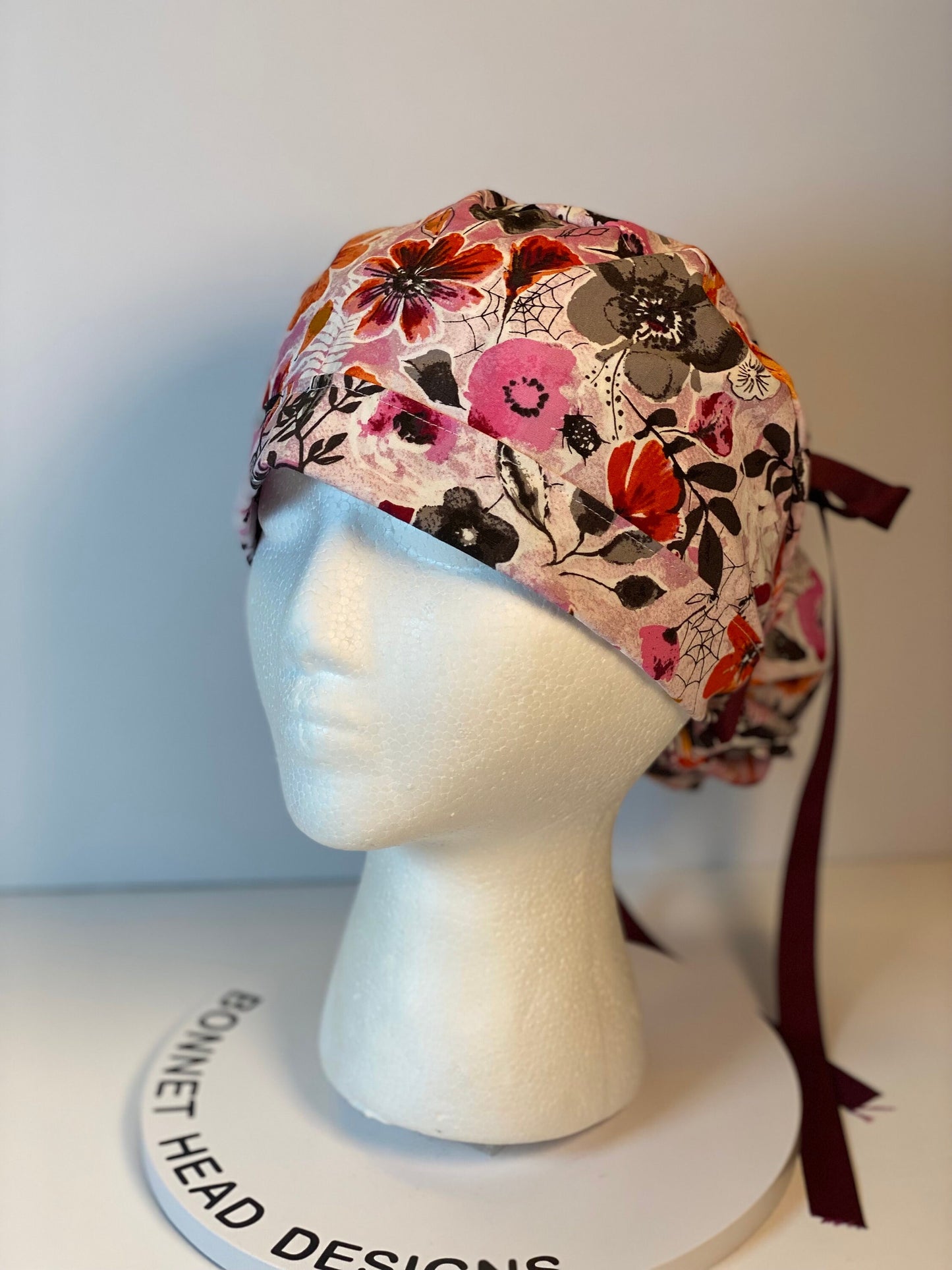 Eerie Halloween pink floral ponytail scrub hat, women’s Halloween floral scrub cap