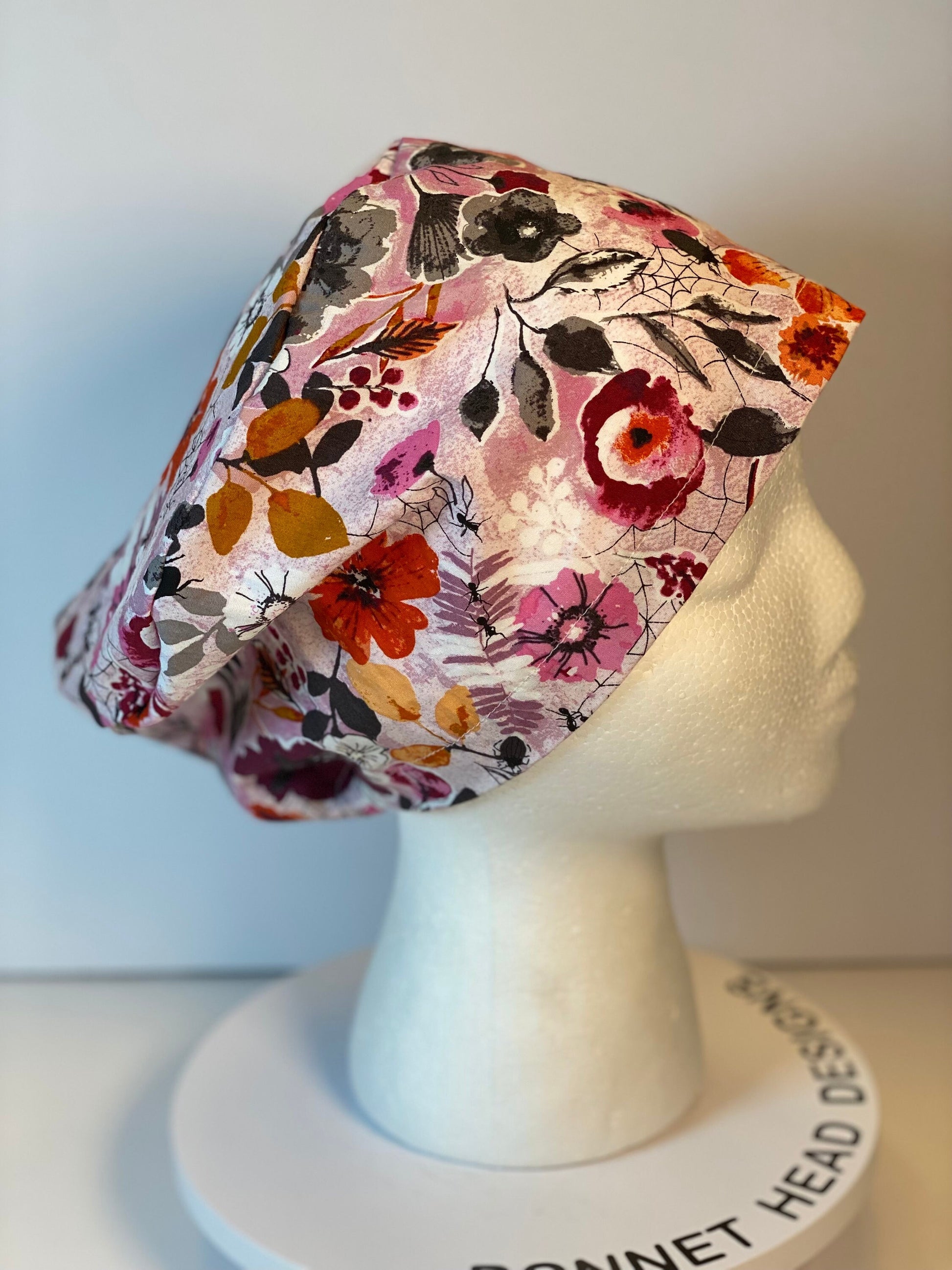 Pink Halloween floral euro scrub hat, women’s eerie Halloween floral euro style scrub cap