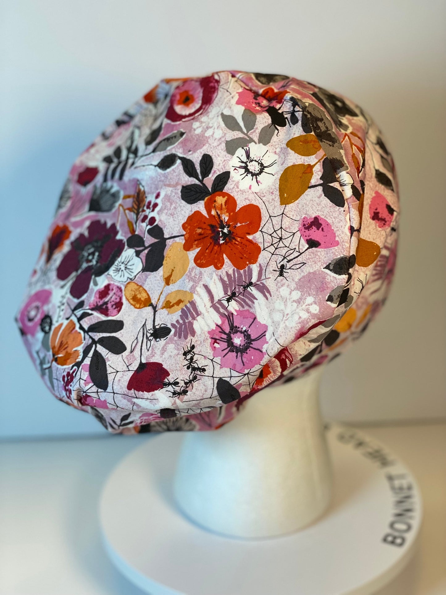 Pink Halloween floral euro scrub hat, women’s eerie Halloween floral euro style scrub cap