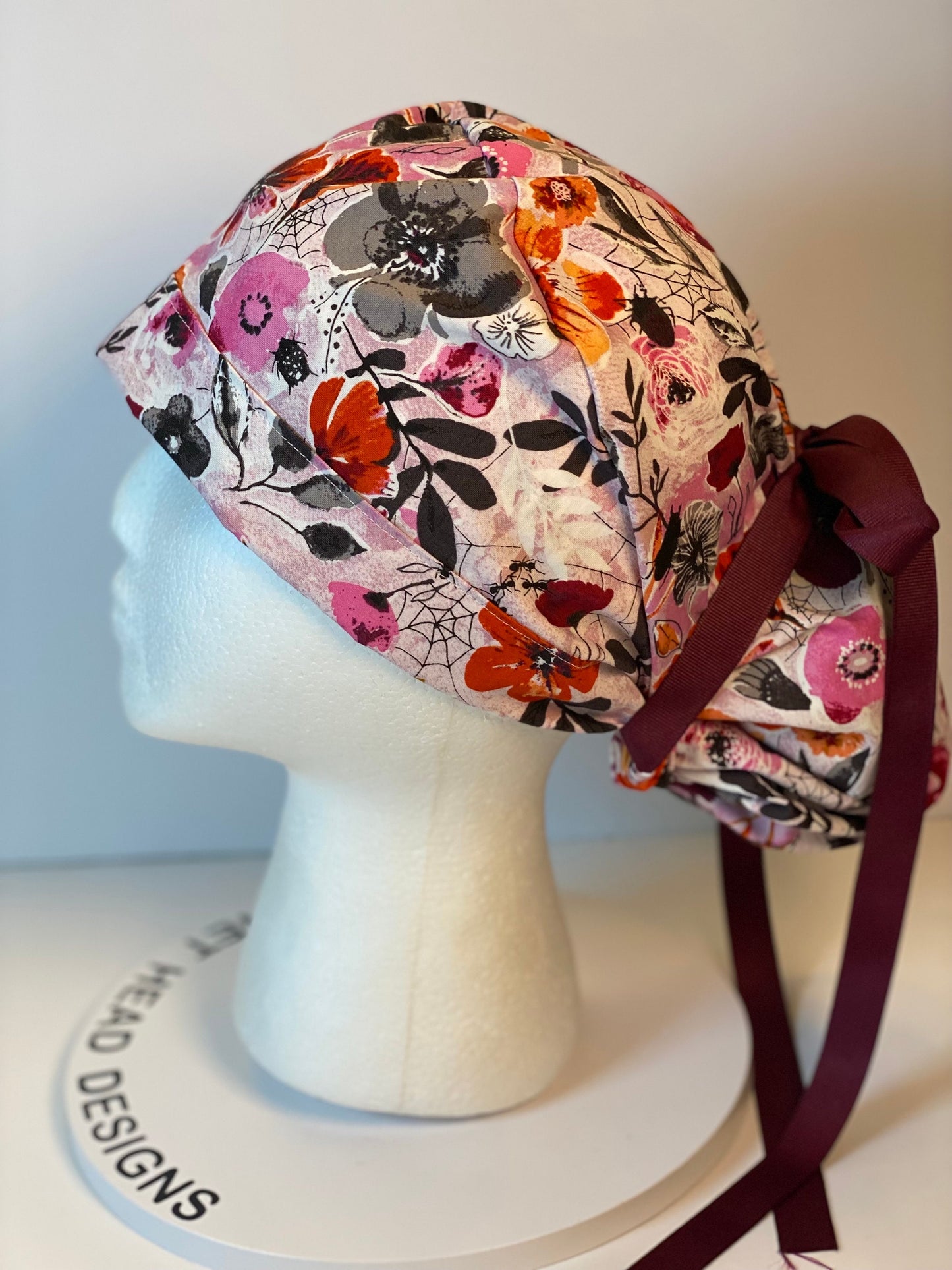 Eerie Halloween pink floral ponytail scrub hat, women’s Halloween floral scrub cap