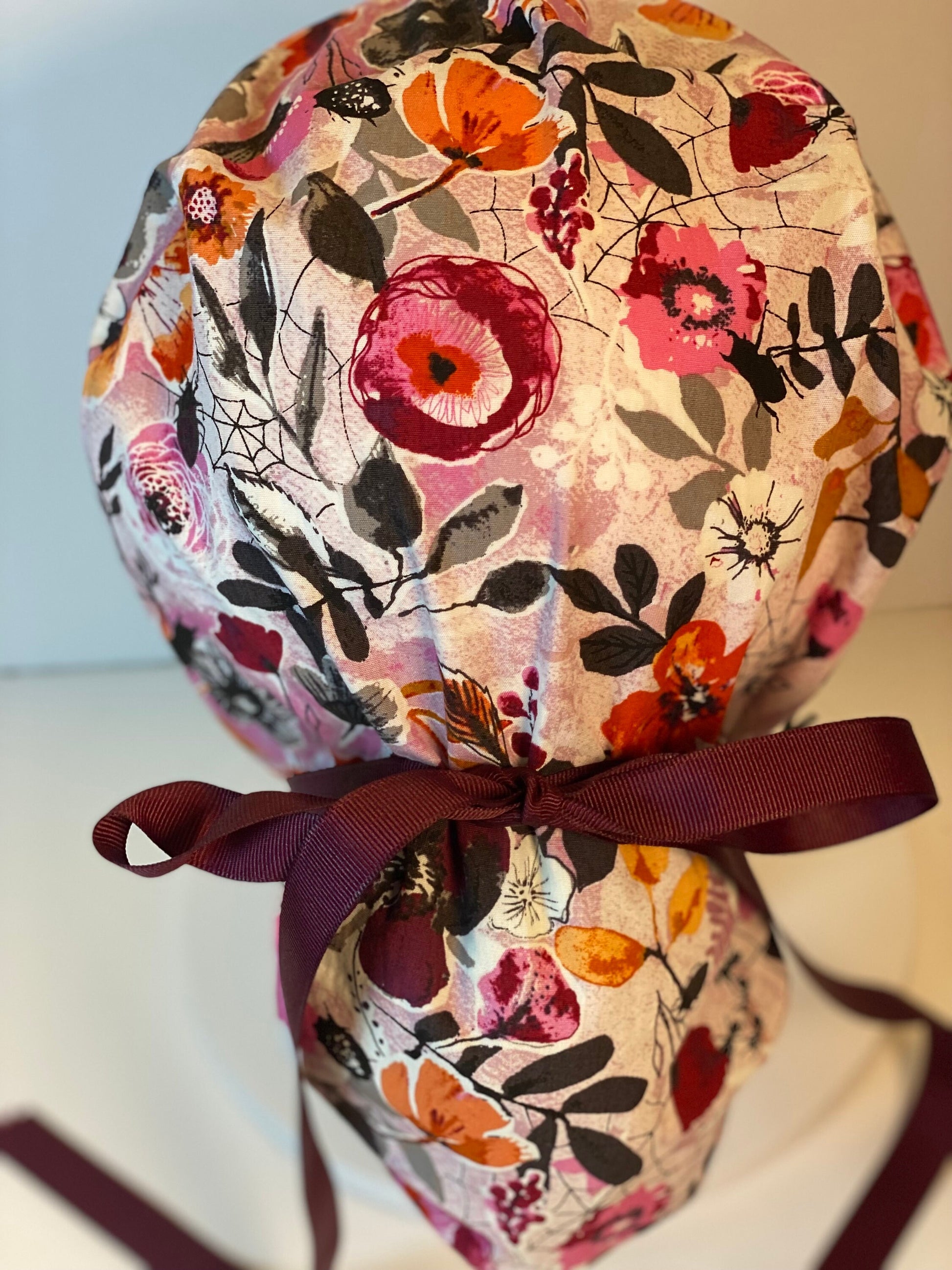 Eerie Halloween pink floral ponytail scrub hat, women’s Halloween floral scrub cap