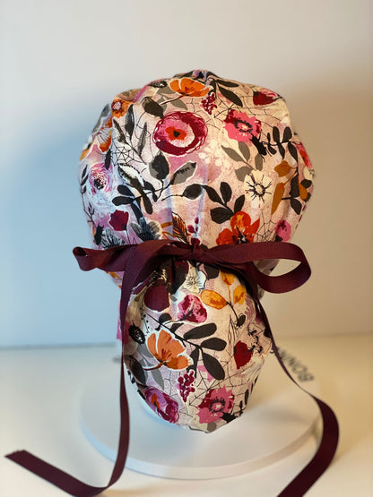 Eerie Halloween pink floral ponytail scrub hat, women’s Halloween floral scrub cap