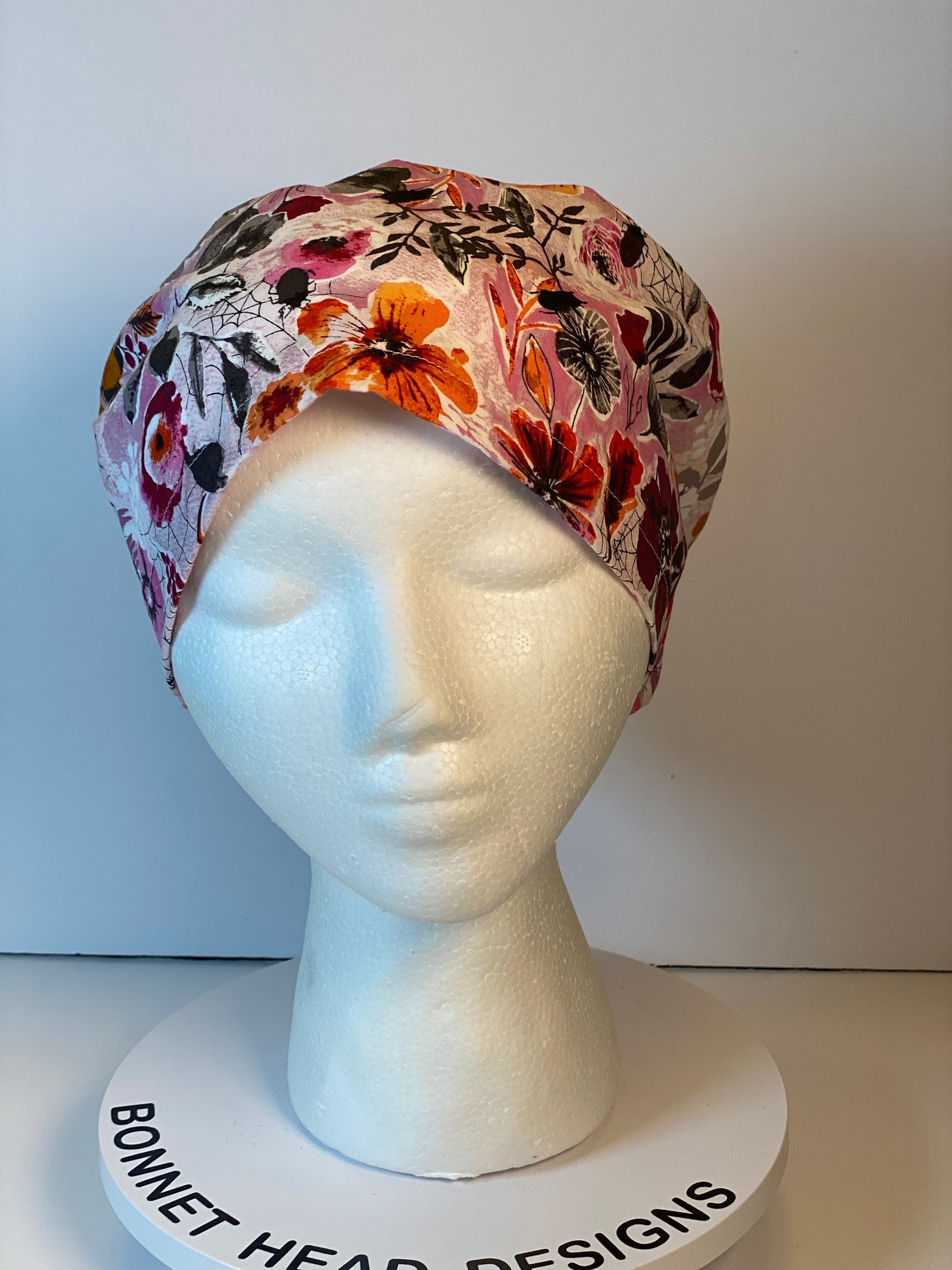 Pink Halloween floral euro scrub hat, women’s eerie Halloween floral euro style scrub cap