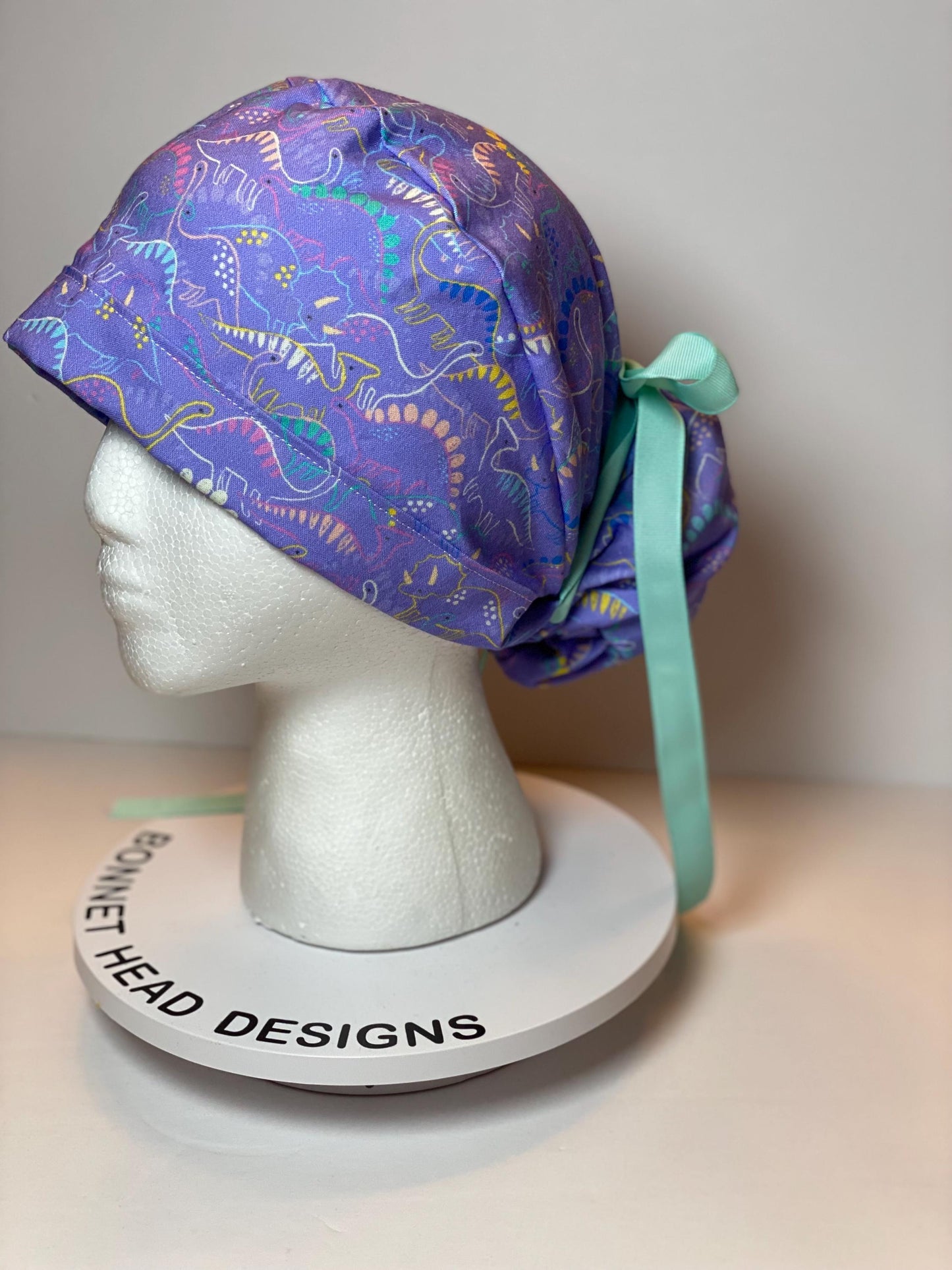 Purple Dinosaur print scrub cap, ponytail scrub hat girly dinosaurs, Bonnet Head Designs