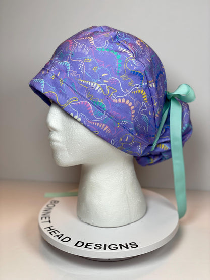 Purple Dinosaur print scrub cap, ponytail scrub hat girly dinosaurs, Bonnet Head Designs