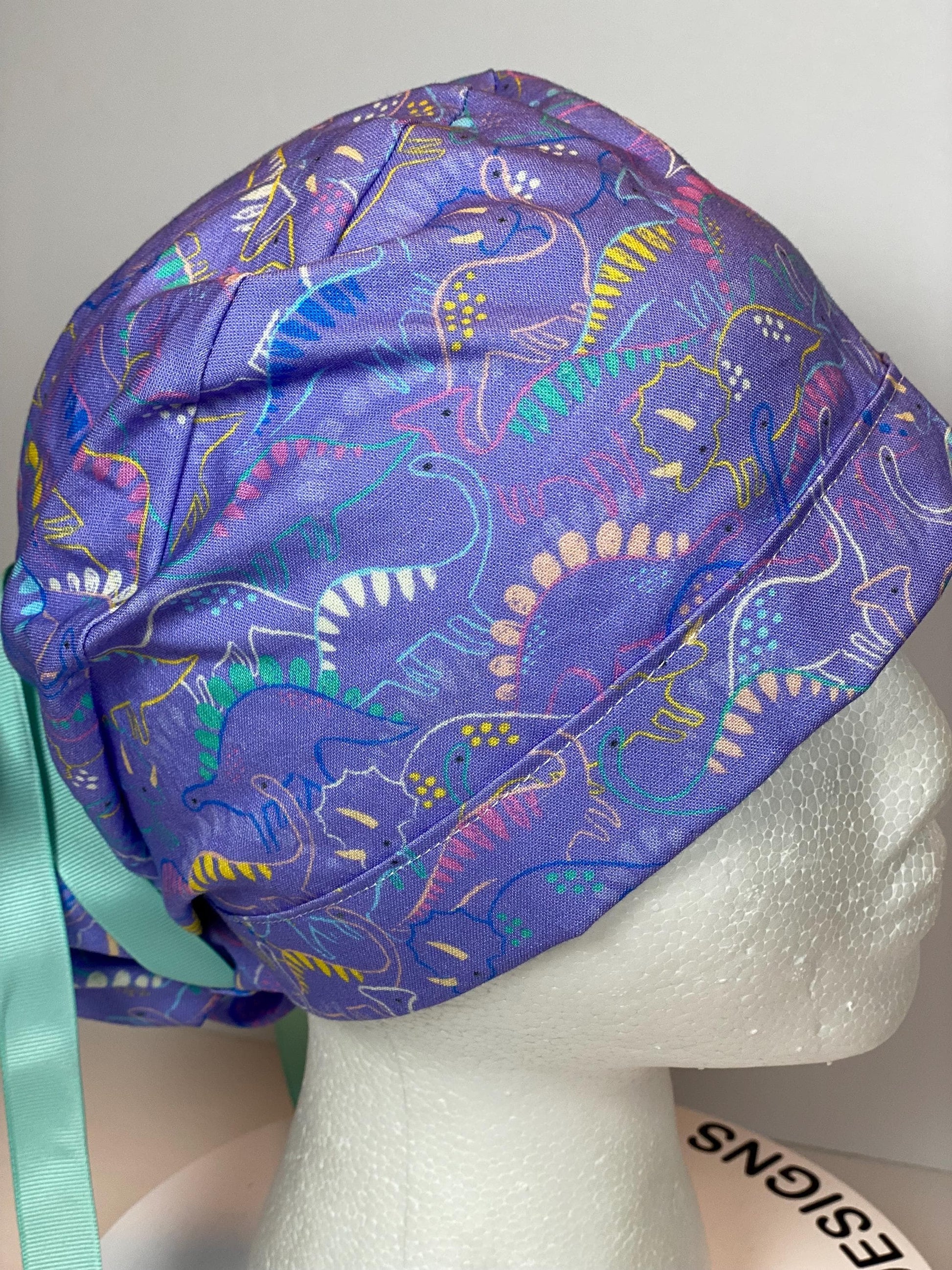 Purple Dinosaur print scrub cap, ponytail scrub hat girly dinosaurs, Bonnet Head Designs