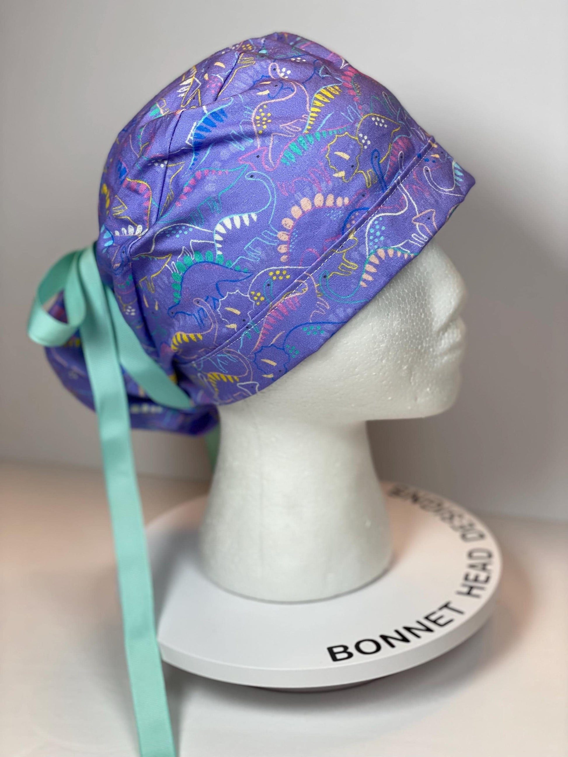 Purple Dinosaur print scrub cap, ponytail scrub hat girly dinosaurs, Bonnet Head Designs