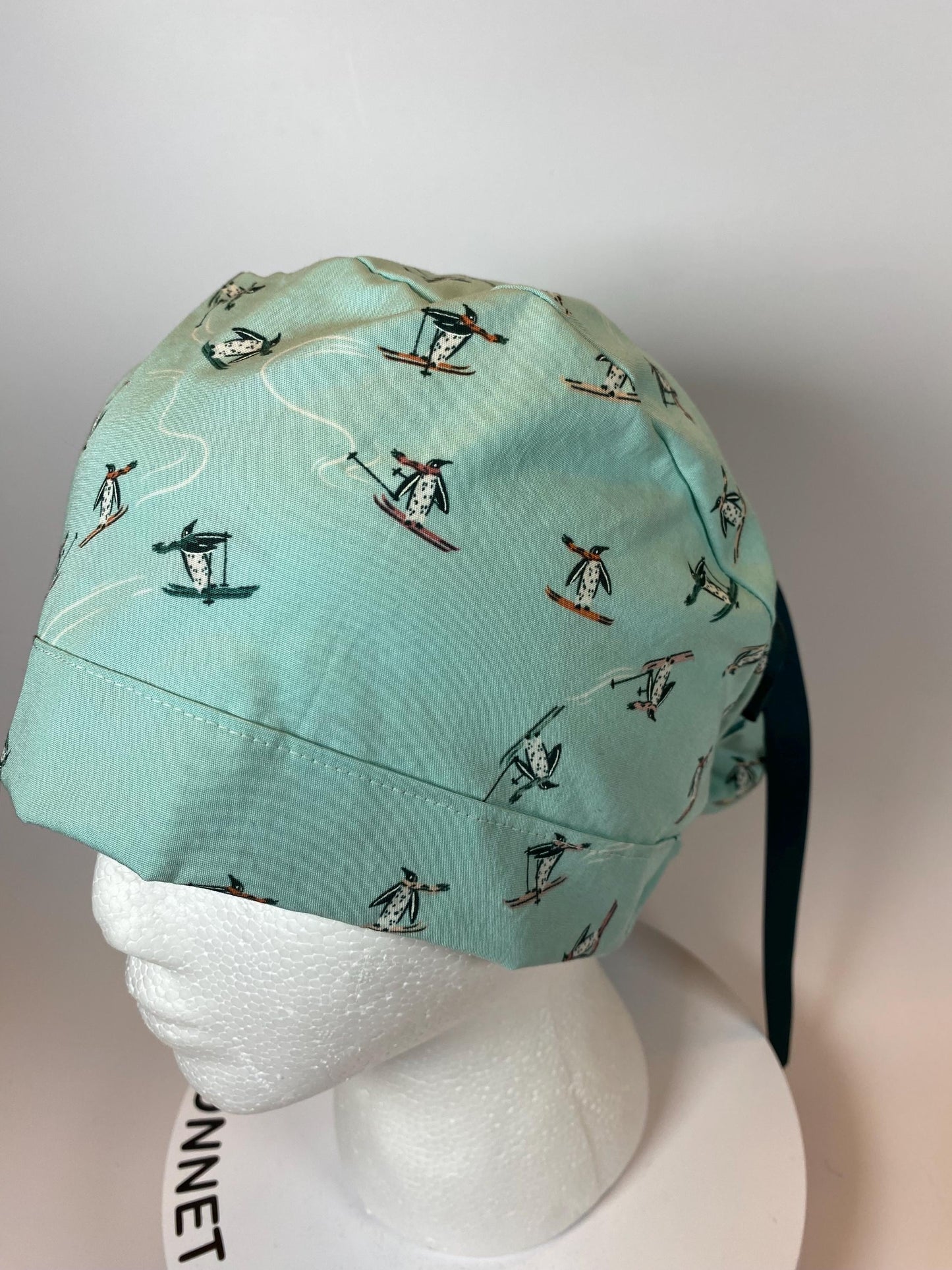 Skiing Penguins winter ponytail style scrub cap, winter penguins scrub hat, Bonnet Head Designs