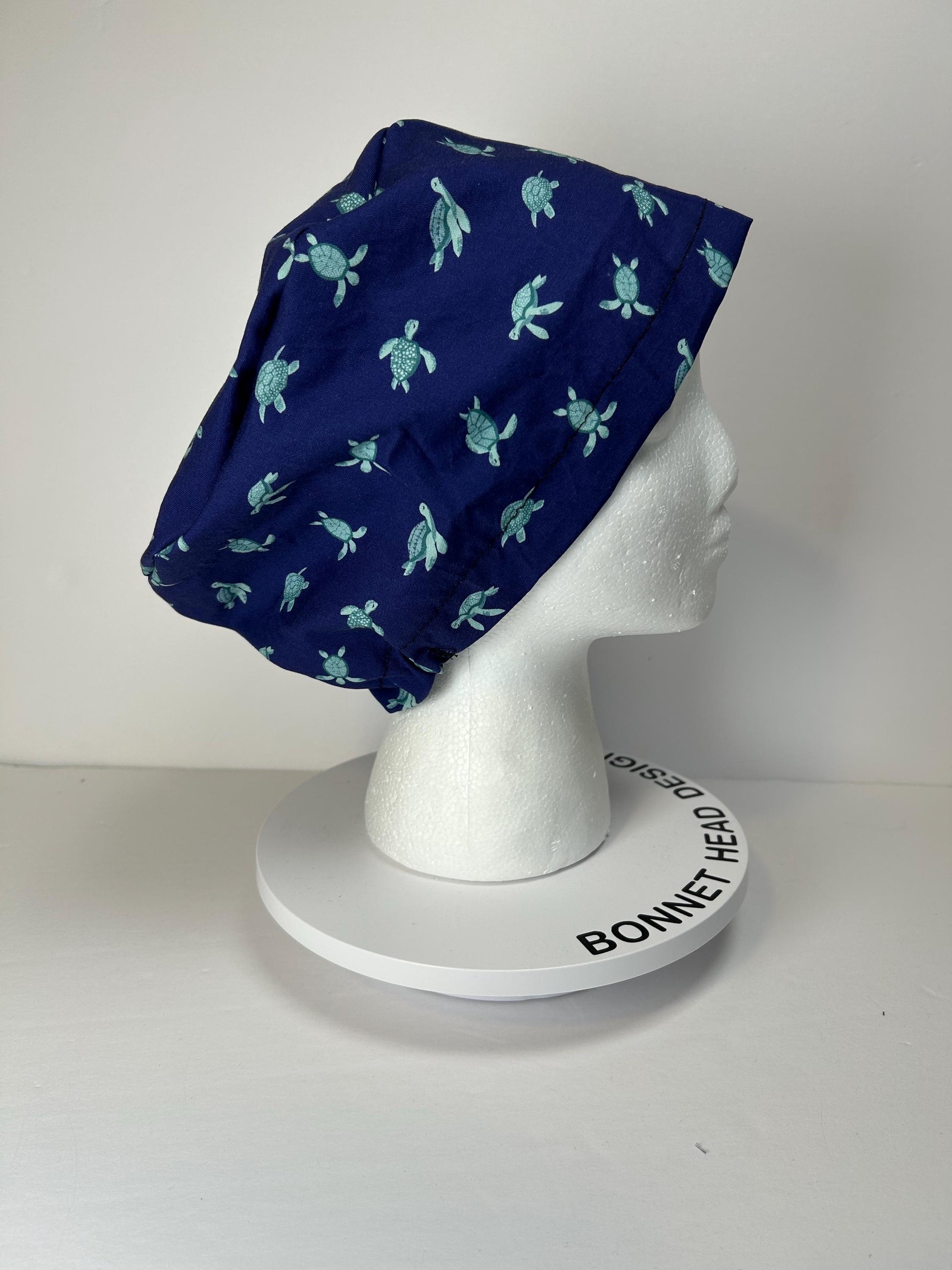 Navy Sea turtle euro style scrub cap, women’s turtle print scrub cap with toggle, Bonnet Head Designs