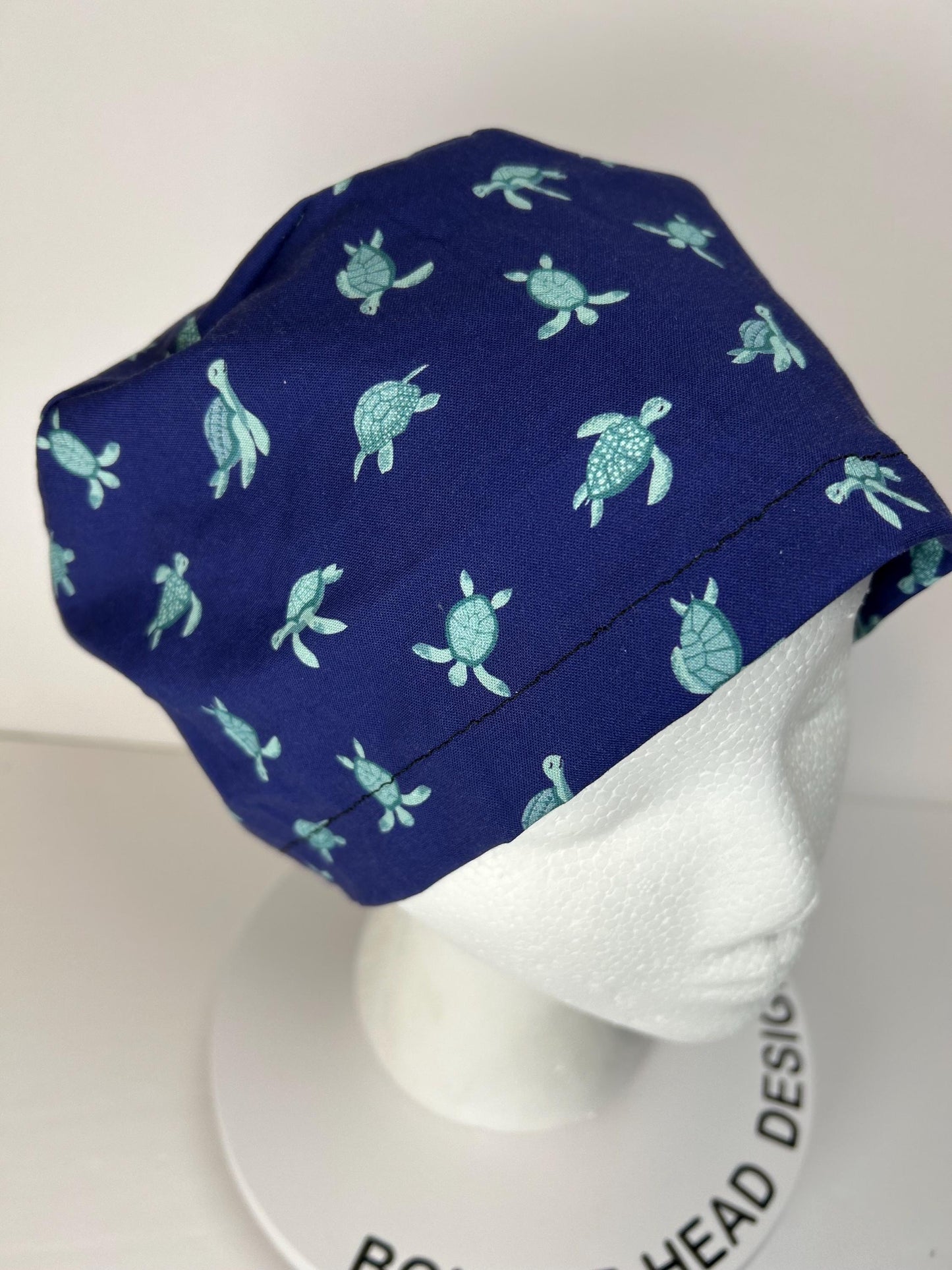 Navy Sea turtle euro style scrub cap, women’s turtle print scrub cap with toggle, Bonnet Head Designs