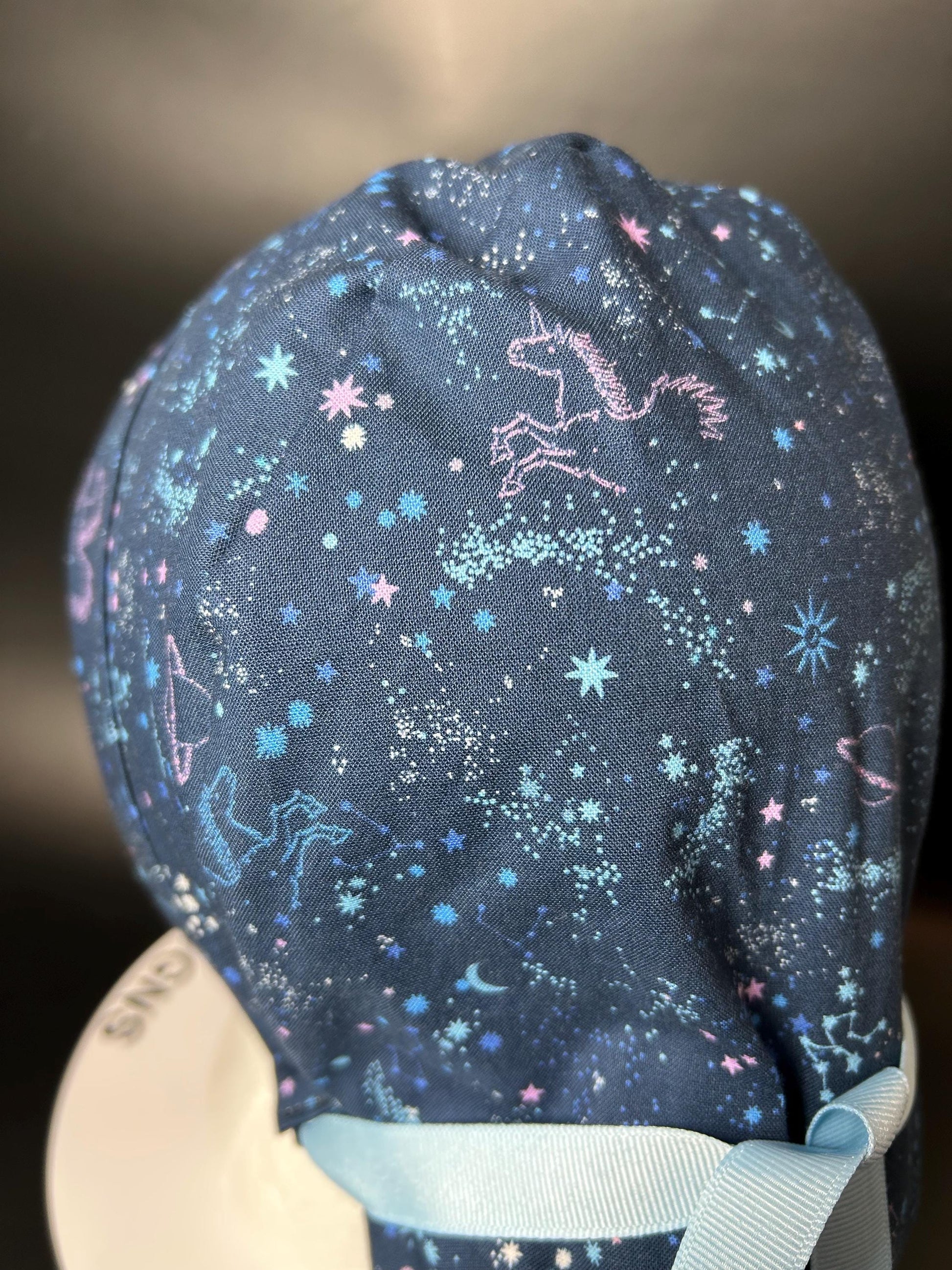 Stargazer Stella in Midnight unicorn stars ponytail scrub hat, women’s navy unicorns constellation star scrub cap