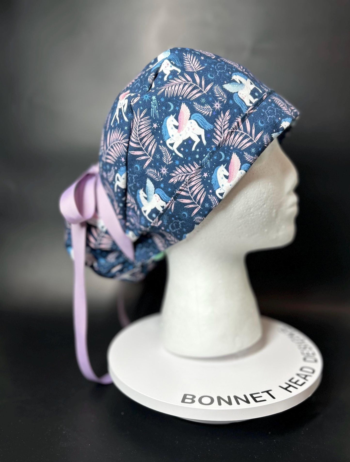 Stargazer Heavenly in Midnight unicorn ponytail scrub hat, women’s navy unicorns scrub cap
