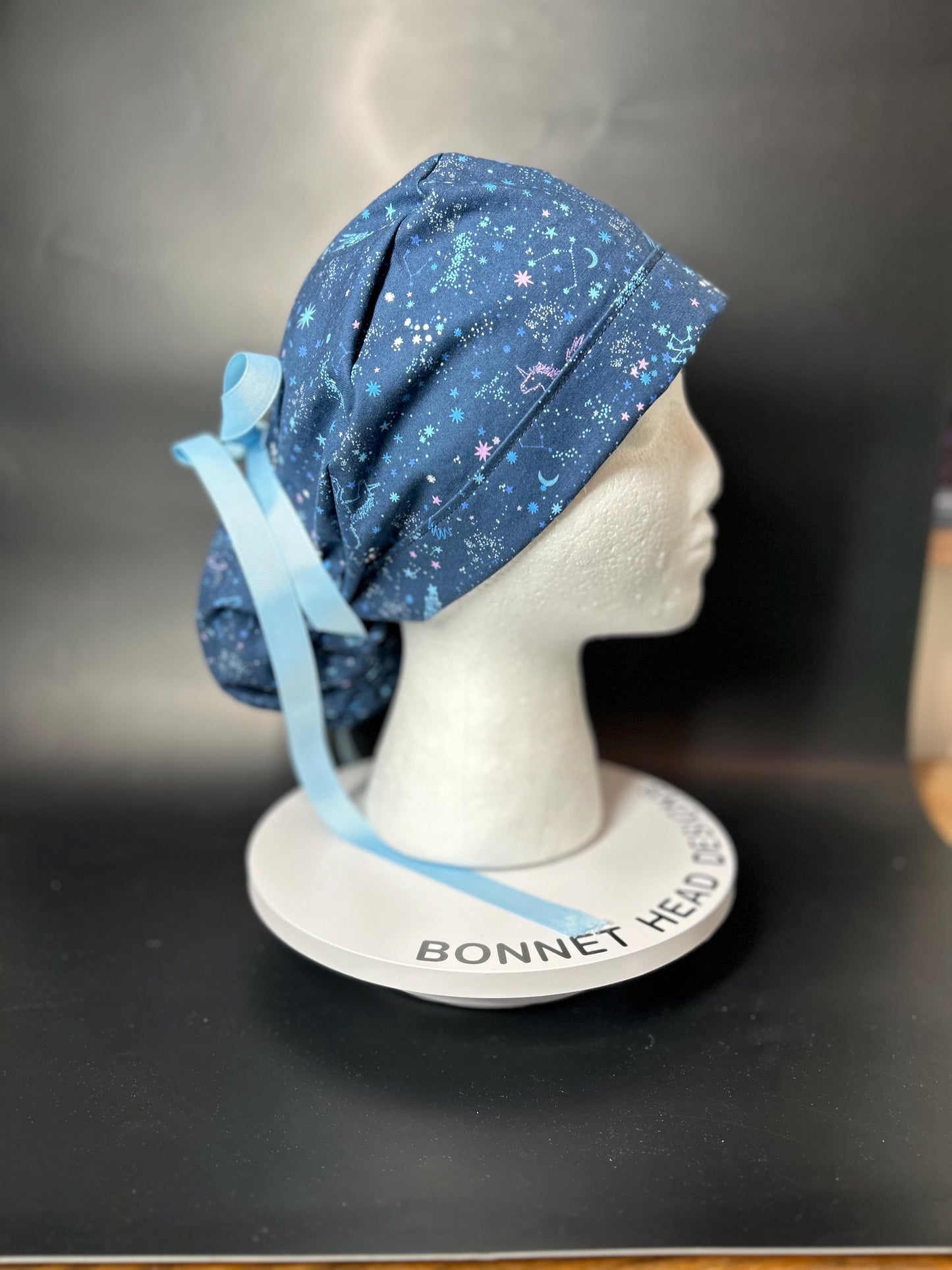 Stargazer Stella in Midnight unicorn stars ponytail scrub hat, women’s navy unicorns constellation star scrub cap