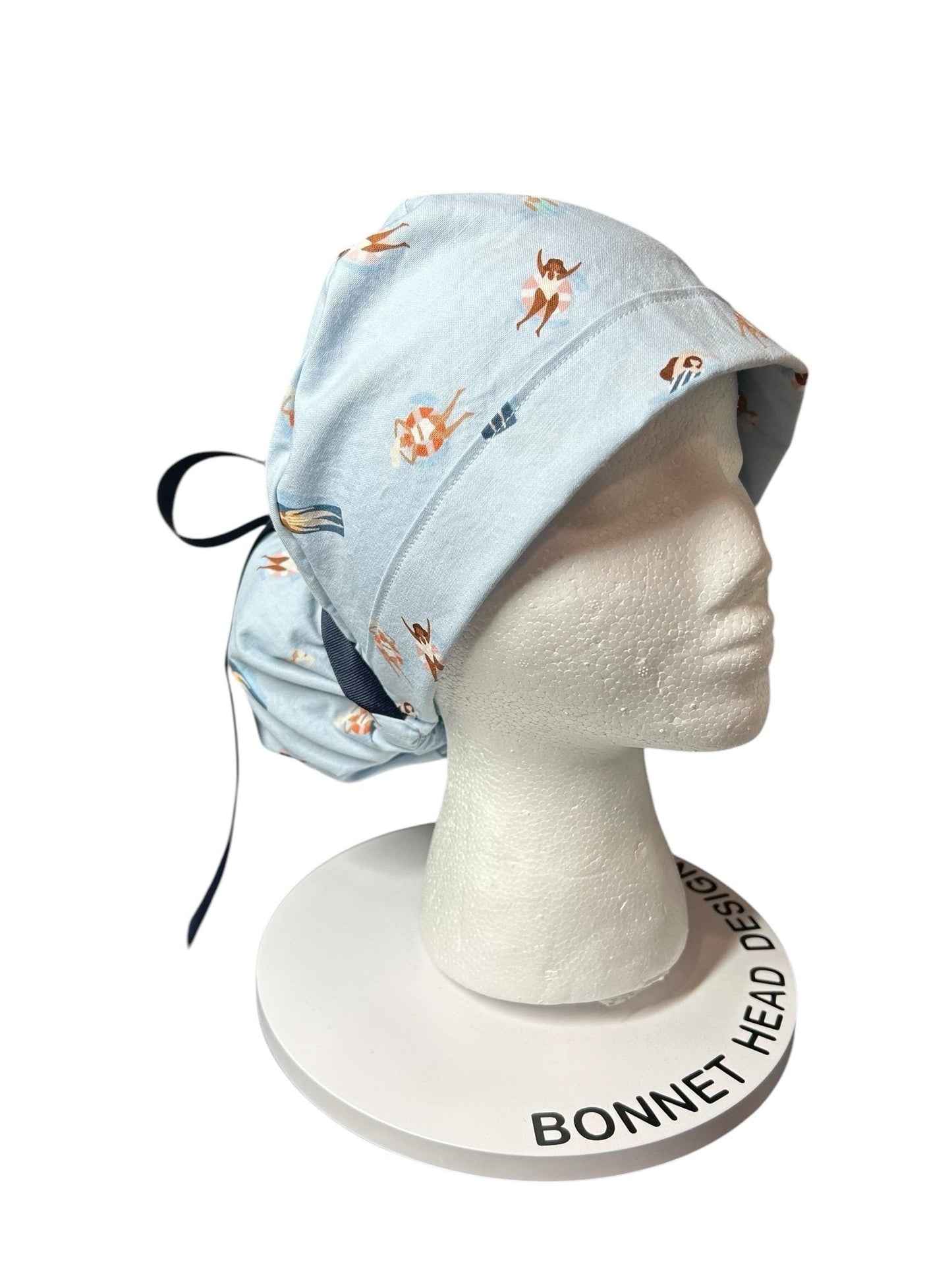 Float Away Sunshine Story ponytail scrub cap, blue summer swim print adjustable pocket ponytail scrub hat