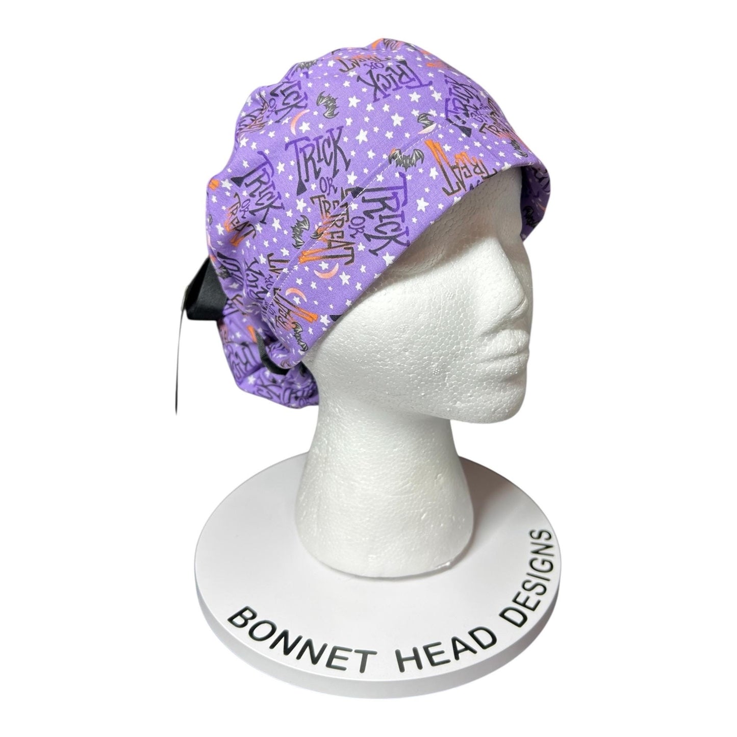 Ponytail Scrub Cap: Women's Halloween nurse hat, purple trick or treat fabric