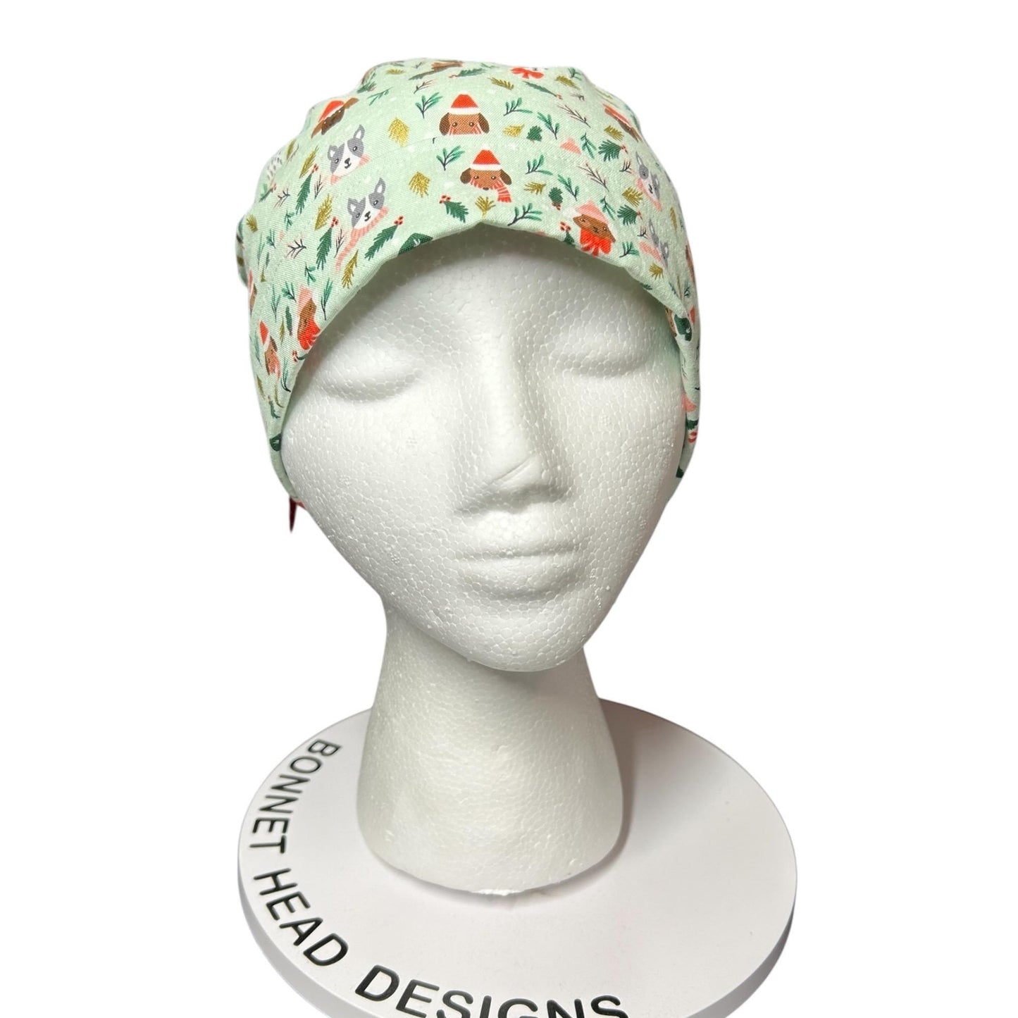 Christmas Dog Scrub Cap: Women's Ponytail Hat in green Merry Pawmas Fabric