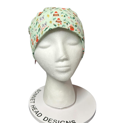 Christmas Dog Scrub Cap: Women's Ponytail Hat in green Merry Pawmas Fabric