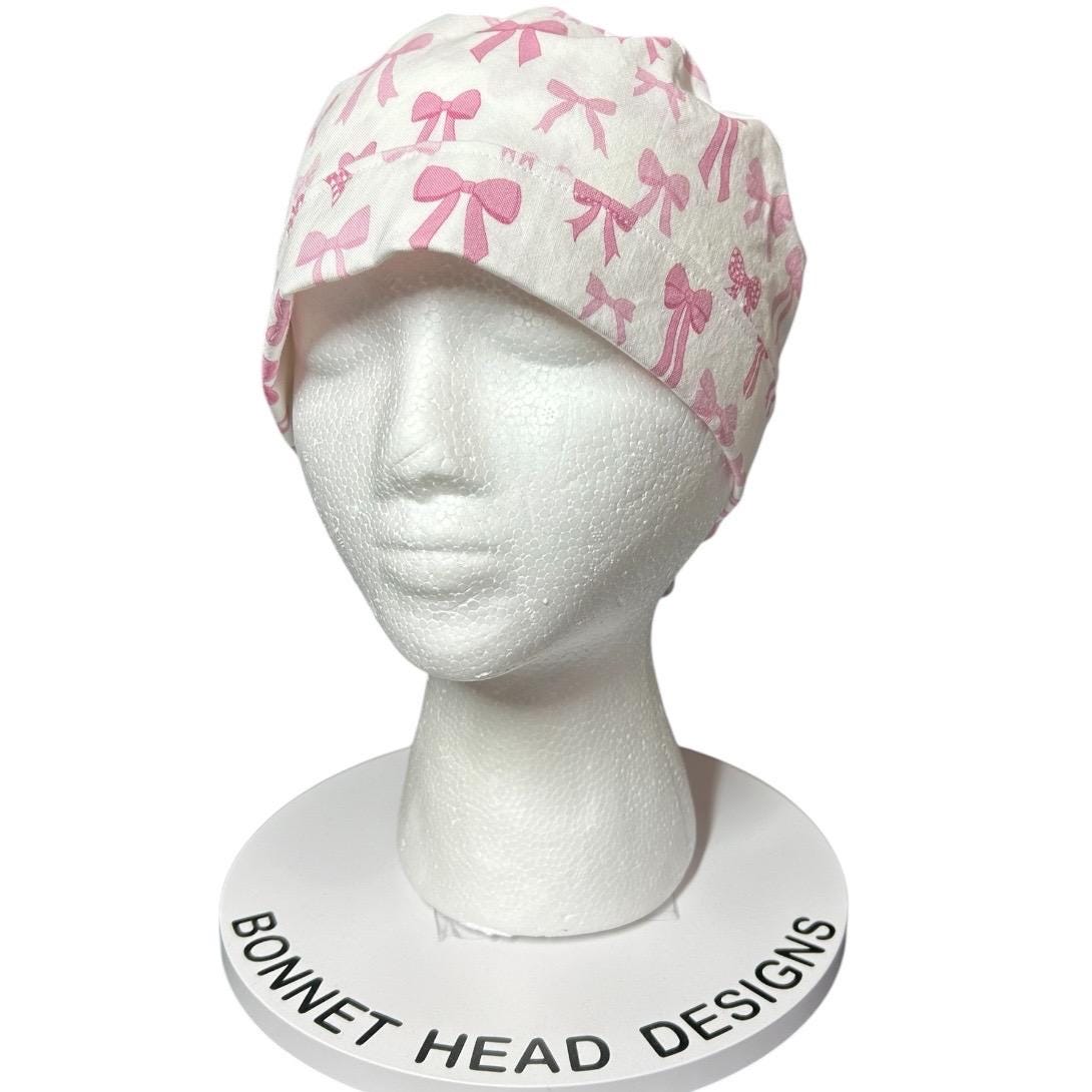 Women’s pink tied with a bow print ponytail scrub cap, pink coquette scrub hat with cinch ties