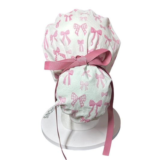 Women’s pink tied with a bow print ponytail scrub cap, pink coquette scrub hat with cinch ties