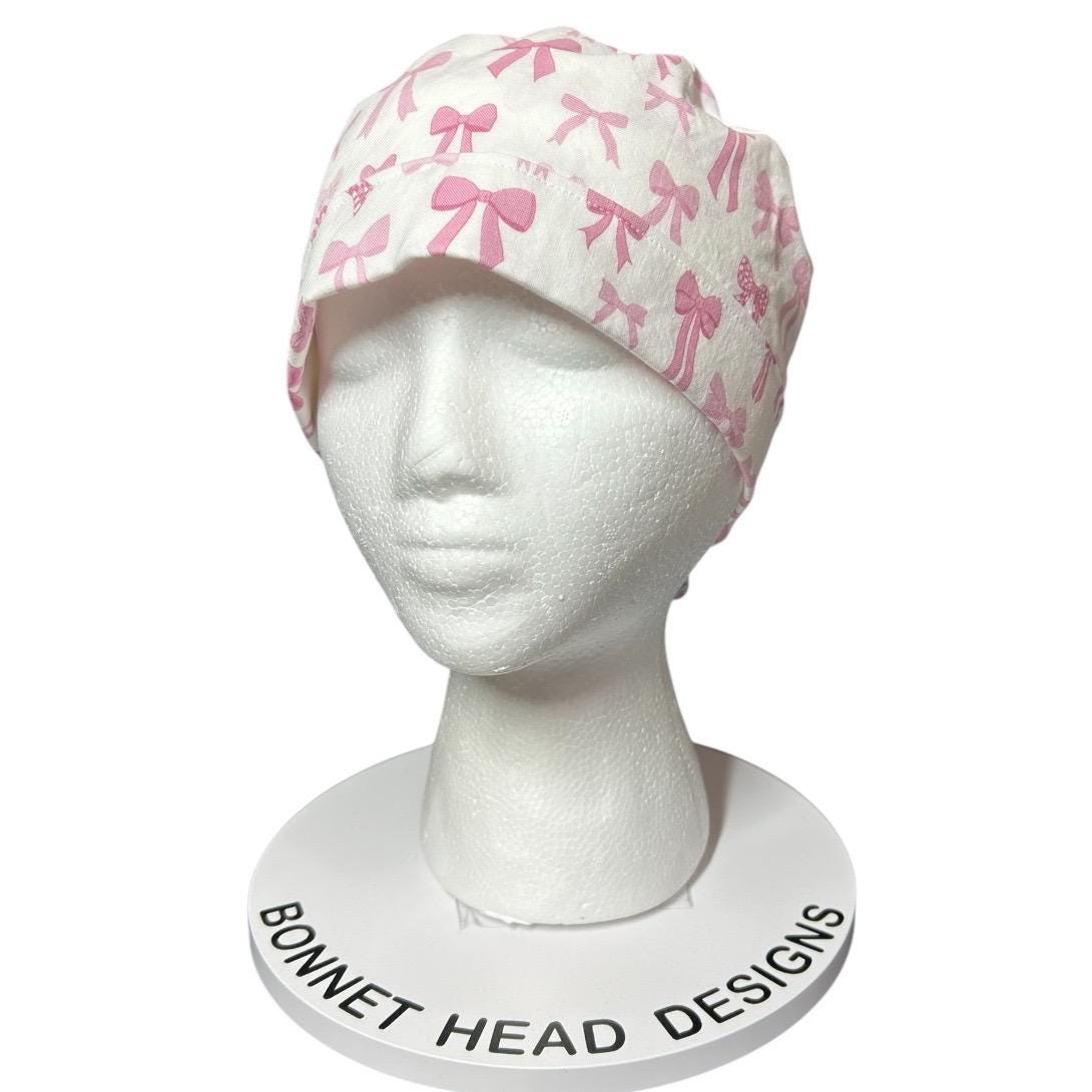 Women’s pink tied with a bow print ponytail scrub cap, pink coquette scrub hat with cinch ties