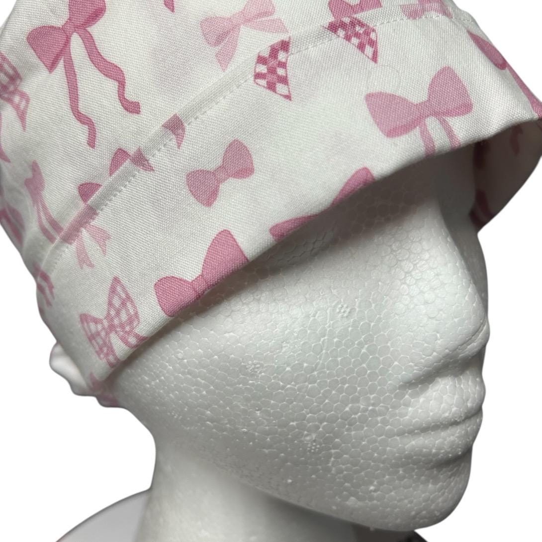 Women’s pink tied with a bow print ponytail scrub cap, pink coquette scrub hat with cinch ties
