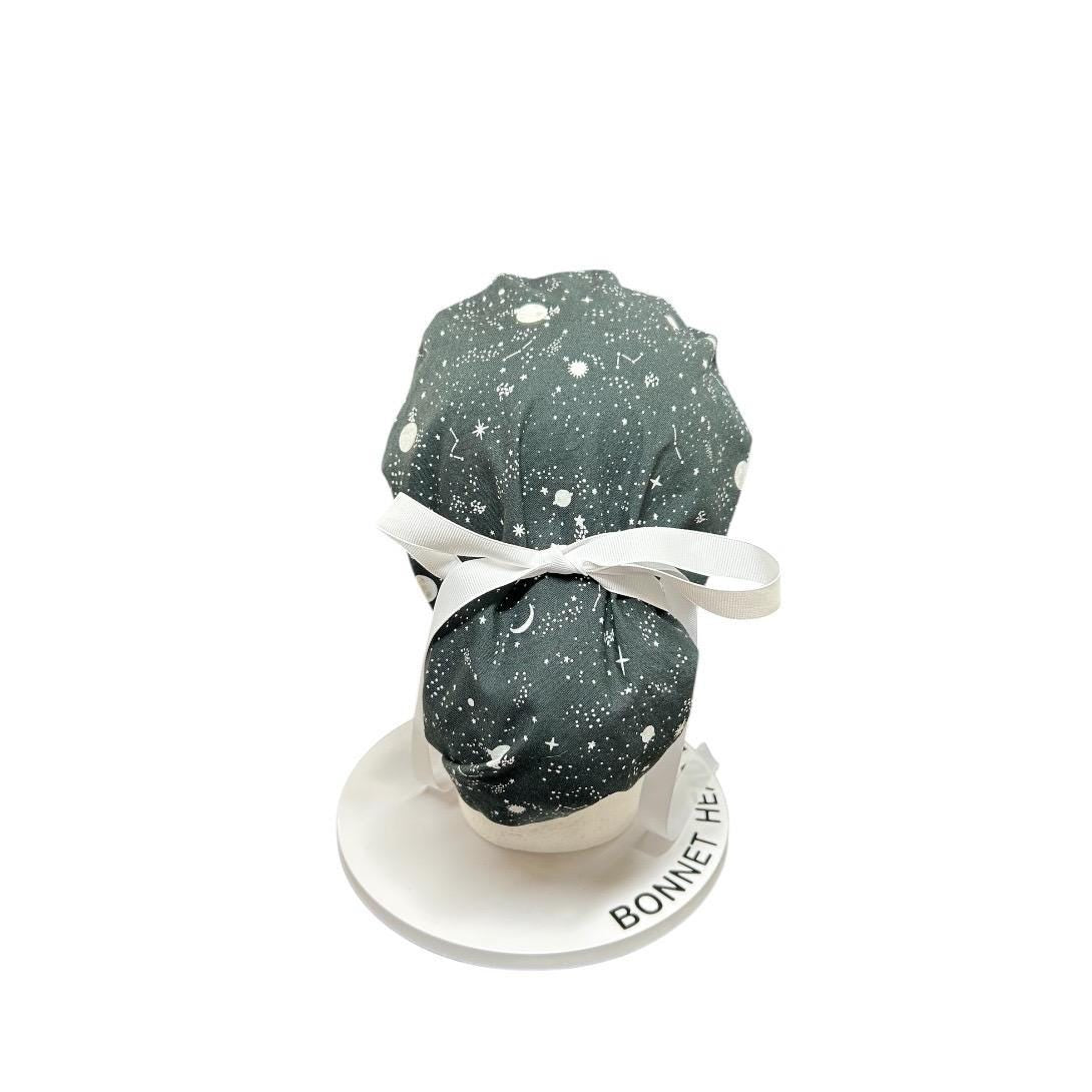 Night sky ponytail scrub hat: Black and white space print fabric with ribbon ties