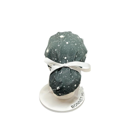 Night sky ponytail scrub hat: Black and white space print fabric with ribbon ties