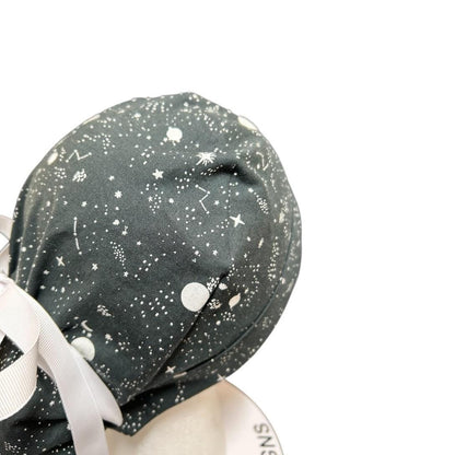 Night sky ponytail scrub hat: Black and white space print fabric with ribbon ties