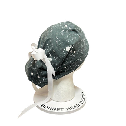 Night sky ponytail scrub hat: Black and white space print fabric with ribbon ties