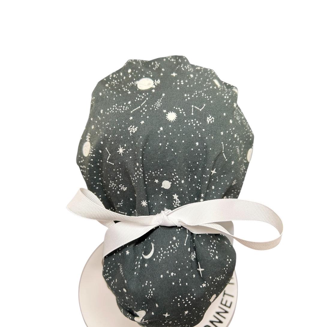 Night sky ponytail scrub hat: Black and white space print fabric with ribbon ties