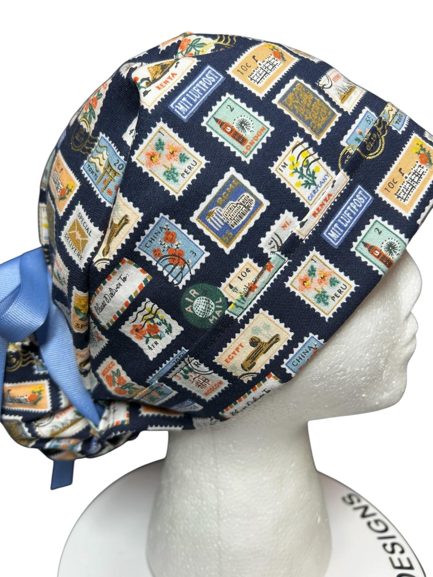 Women’s scrub cap: Rifle Paper Co navy stamp print with ribbon ties