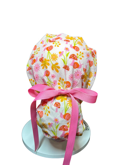 Women’s Ponytail Scrub Cap: Adjustable Cotton Scrub Hat in pink snail fabric