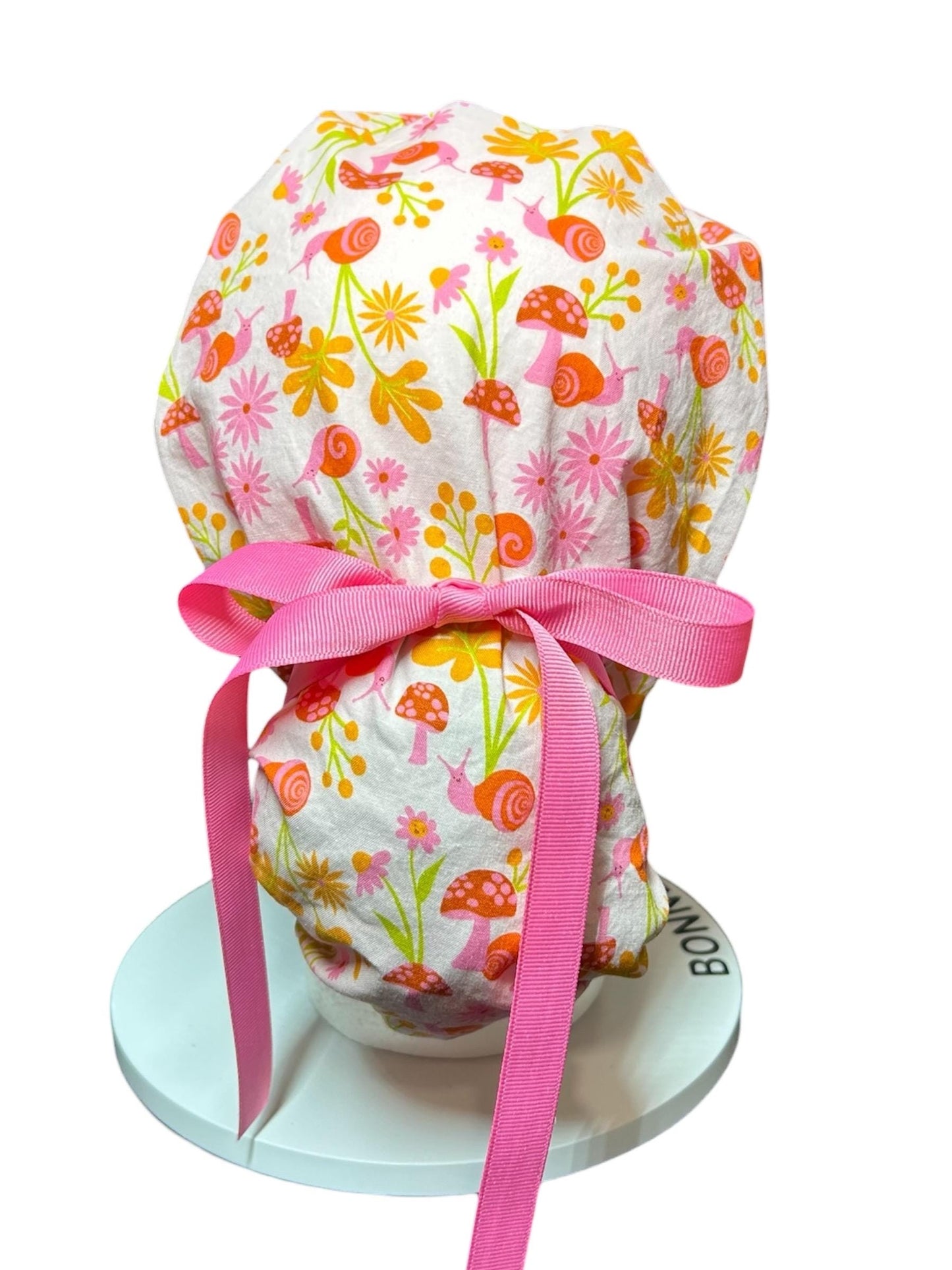 Women’s Ponytail Scrub Cap: Adjustable Cotton Scrub Hat in pink snail fabric