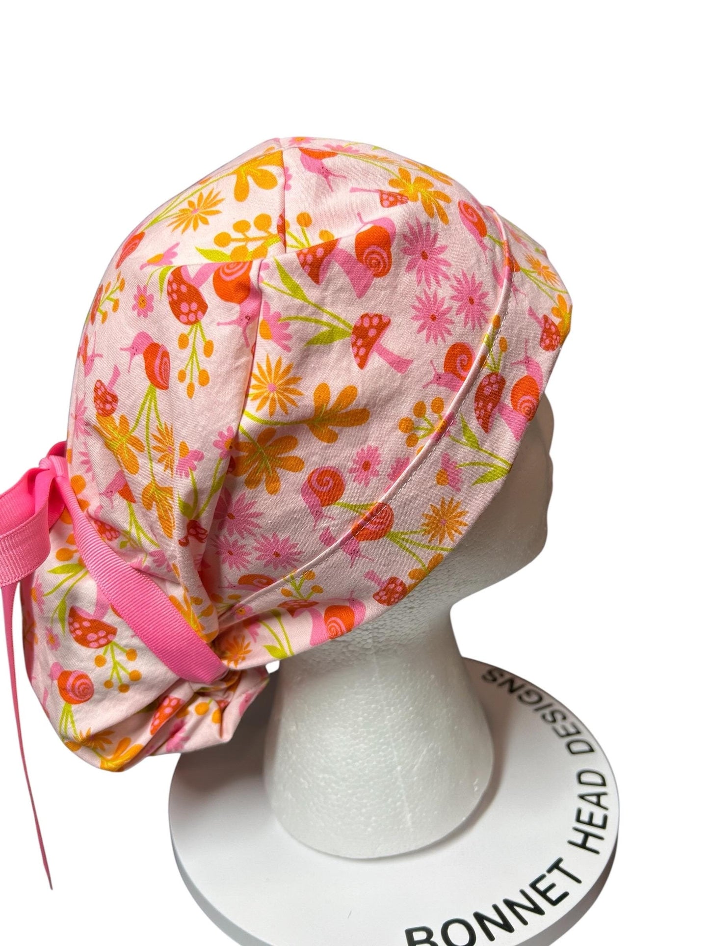 Women’s Ponytail Scrub Cap: Adjustable Cotton Scrub Hat in pink snail fabric