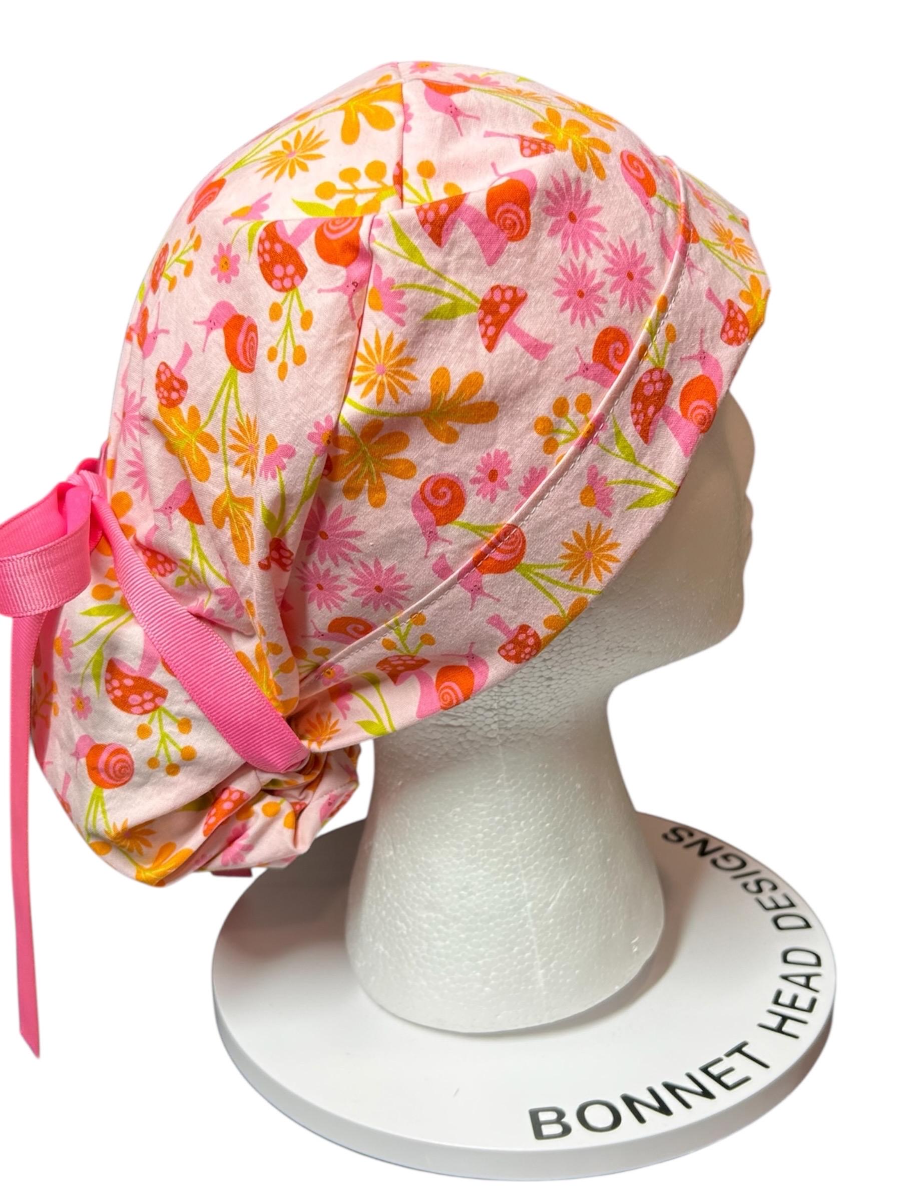 Women’s Ponytail Scrub Cap: Adjustable Cotton Scrub Hat in pink snail fabric