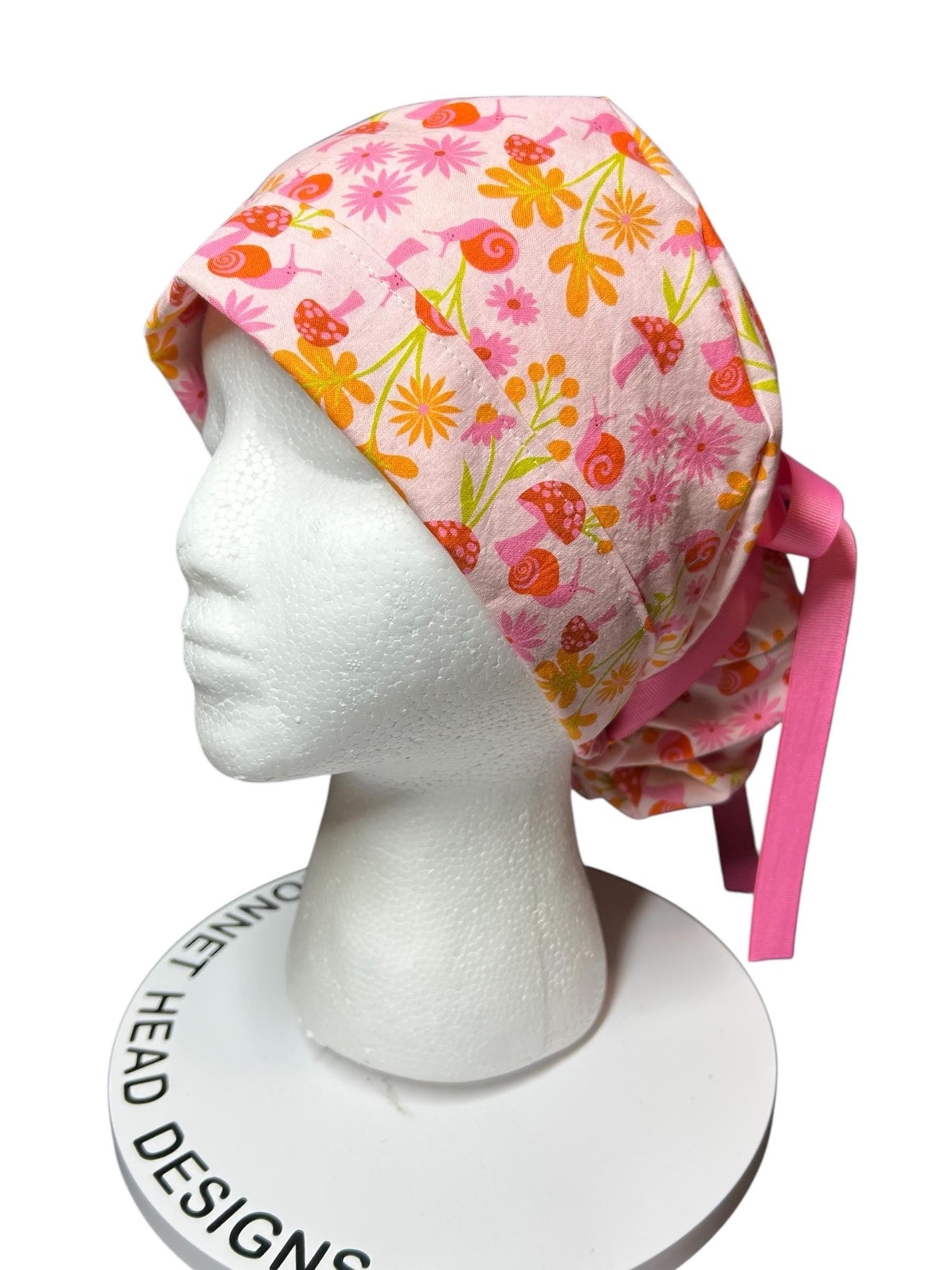 Women’s Ponytail Scrub Cap: Adjustable Cotton Scrub Hat in pink snail fabric