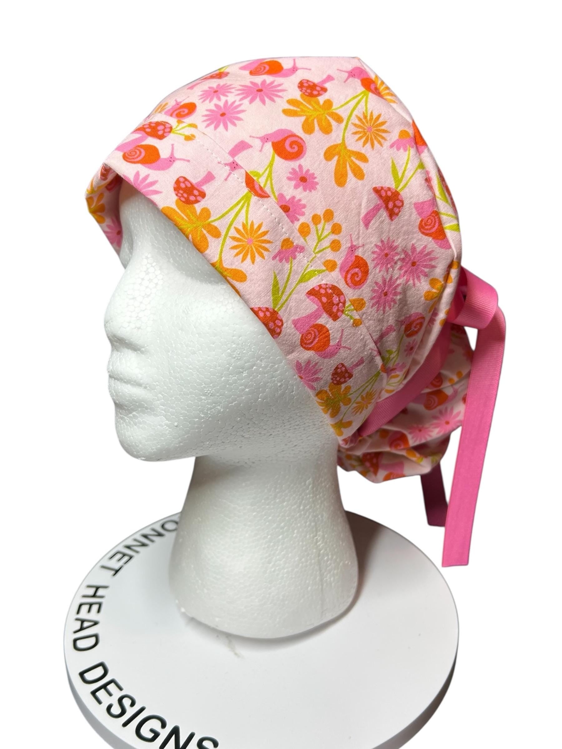 Women’s Ponytail Scrub Cap: Adjustable Cotton Scrub Hat in pink snail fabric