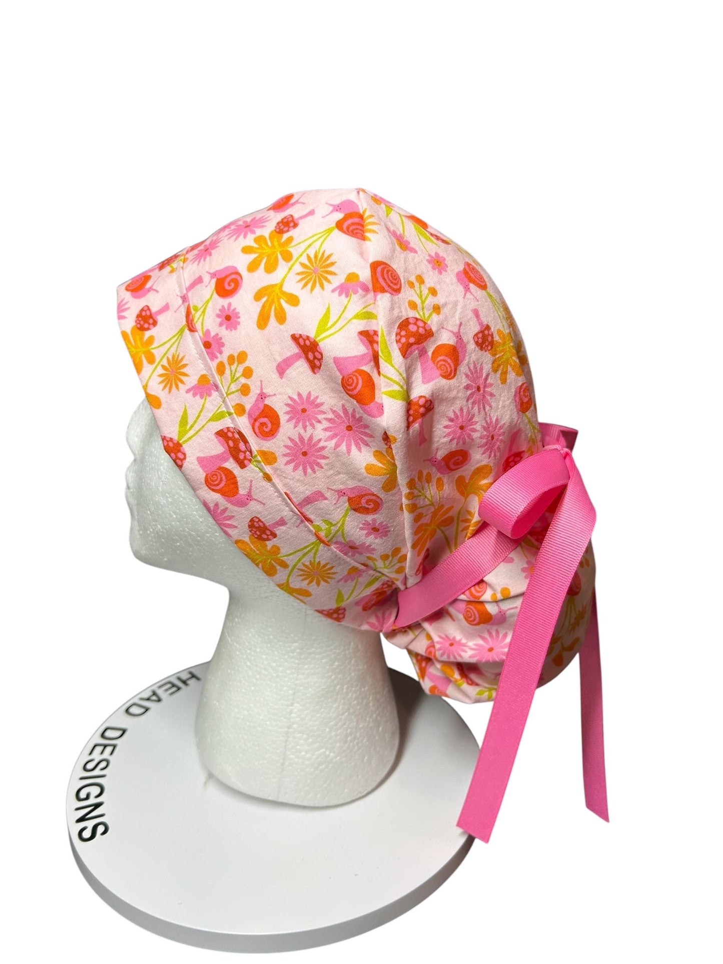 Women’s Ponytail Scrub Cap: Adjustable Cotton Scrub Hat in pink snail fabric