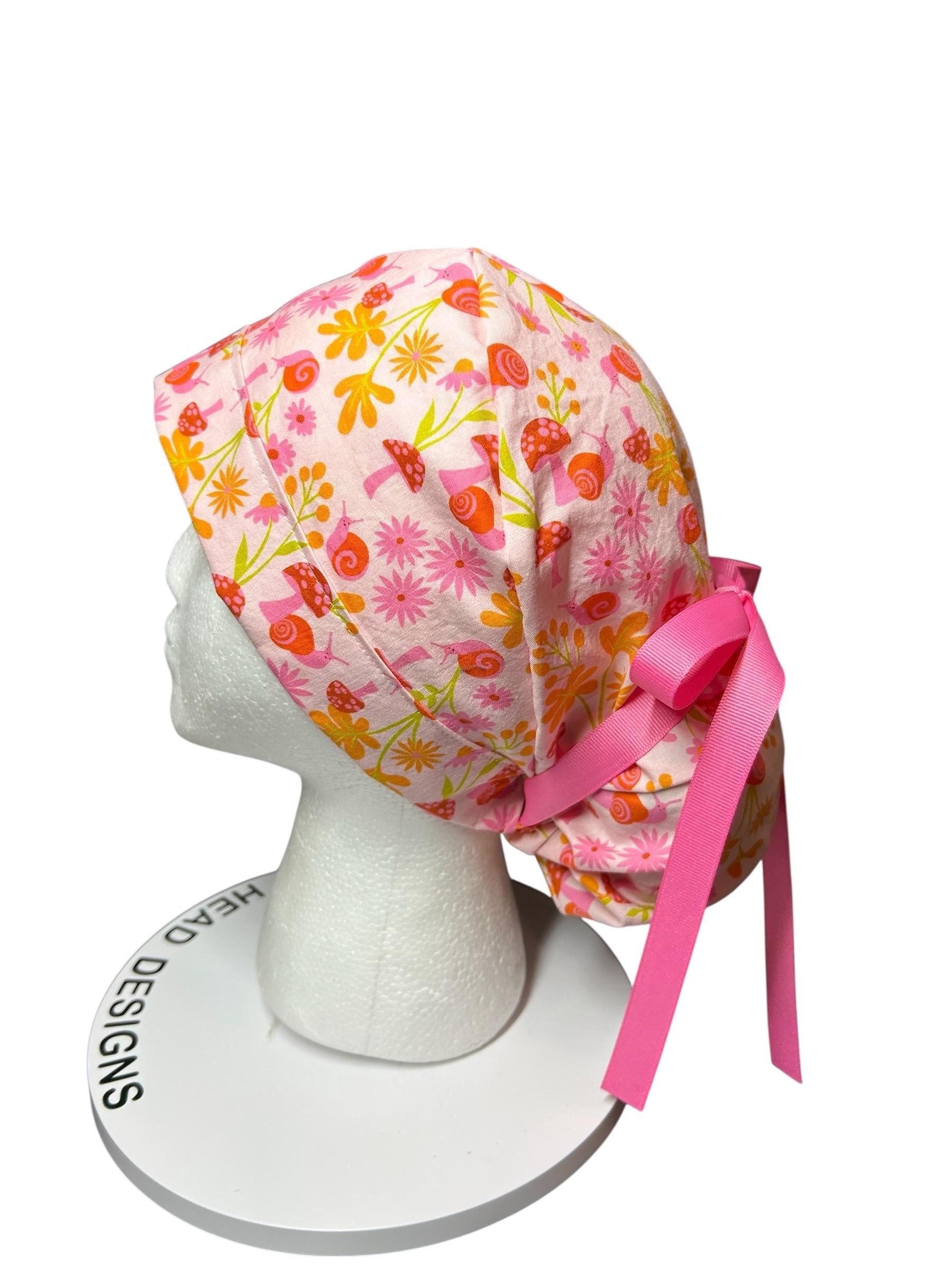 Women’s Ponytail Scrub Cap: Adjustable Cotton Scrub Hat in pink snail fabric
