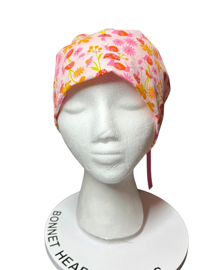 Women’s Ponytail Scrub Cap: Adjustable Cotton Scrub Hat in pink snail fabric